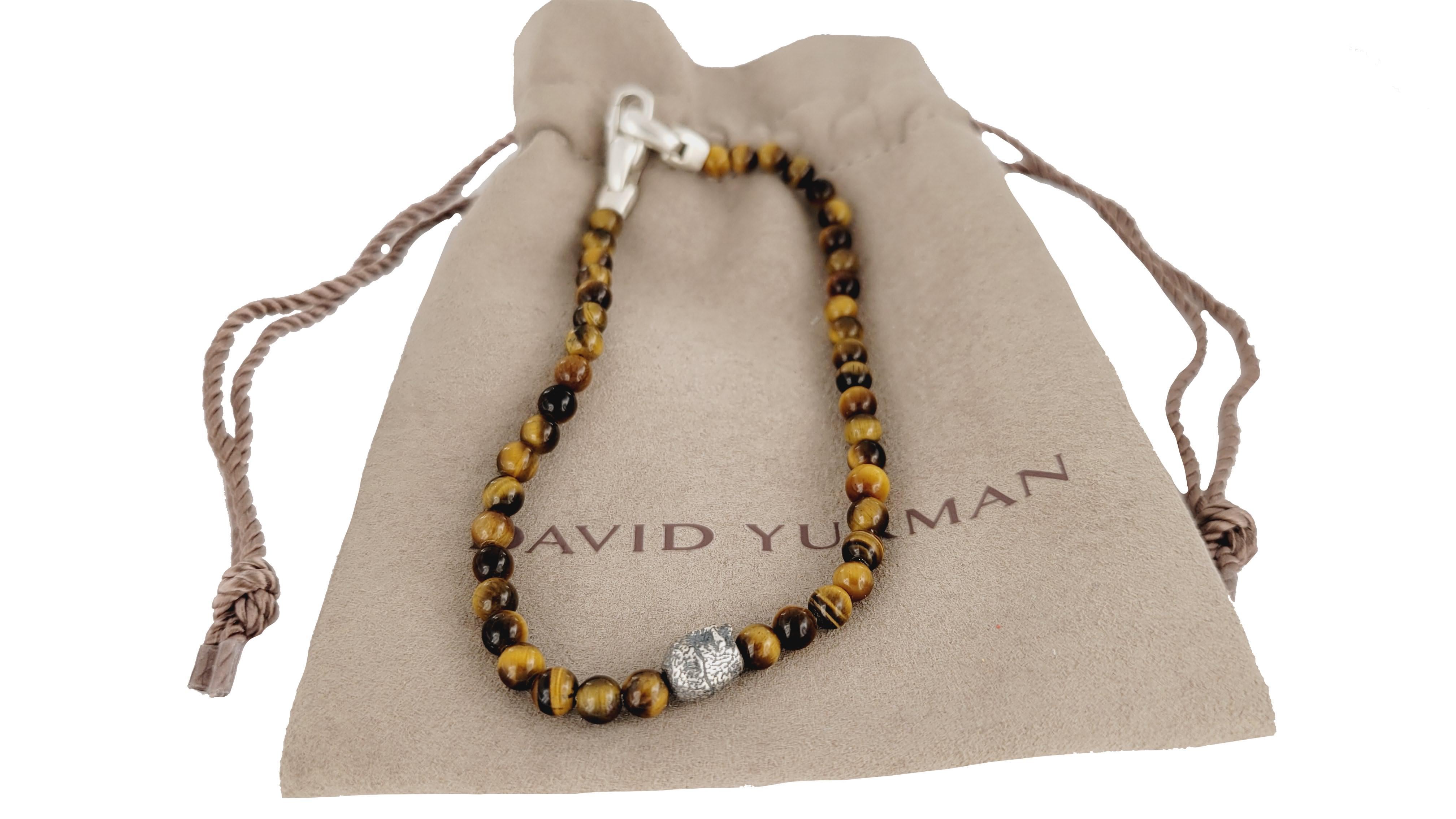Brand David Yurman
Memento Mori Collection For Men
Material Sterling Silver 925
Bracelet Length 8.75'' Long
Tiger-Eye Beads 4mm
Skull Dimension 7.7mm X 6.2mm
Gender men
Condition New
Comes with David Yurman Pouch