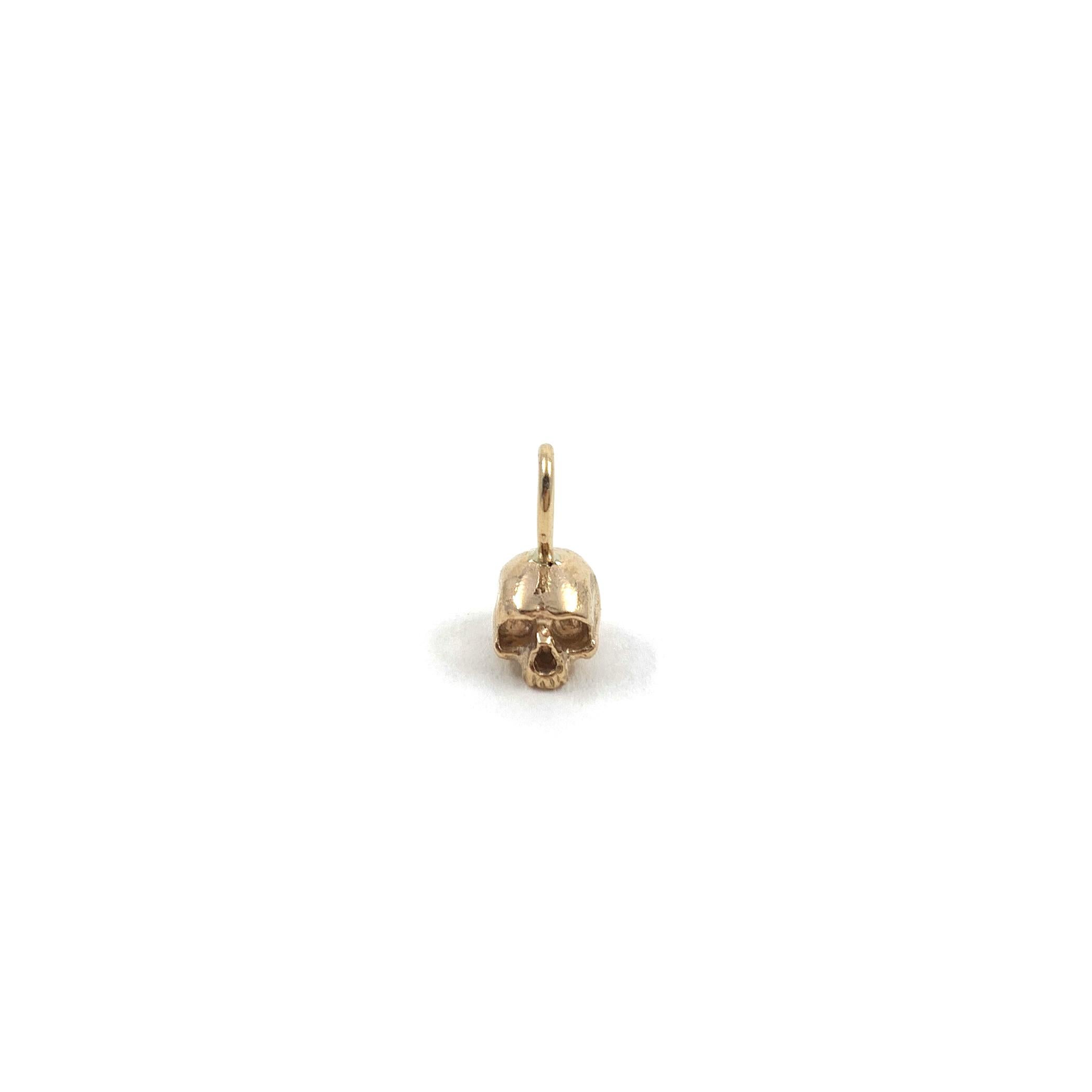 Love skulls? This tiny memento mori skull charm is the lightweight pendant for you then. Designed and fabricated by Alex Jacques Designs, each hand sculpted skull pendant is cast in solid 14k yellow gold and finished by hand. Memento mori as well as