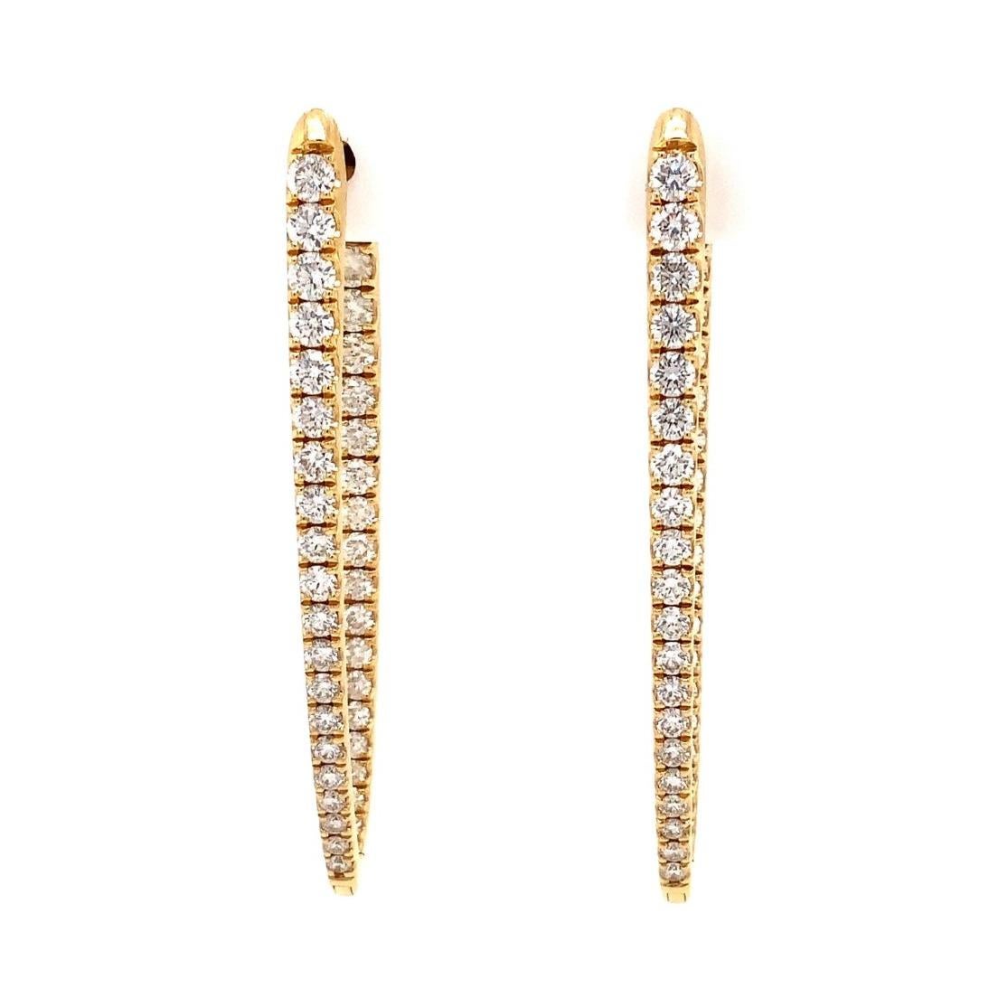 This Memoire Imperial Collection Diamond Hoop Earring Set is crafted from 18K Yellow Gold, containing 74 Diamonds that total 1.67 carats. Of F-G Color, these Diamonds have a VS1-SI1 Clarity, with a diameter of 40 mm and a width of 13mm. This Earring
