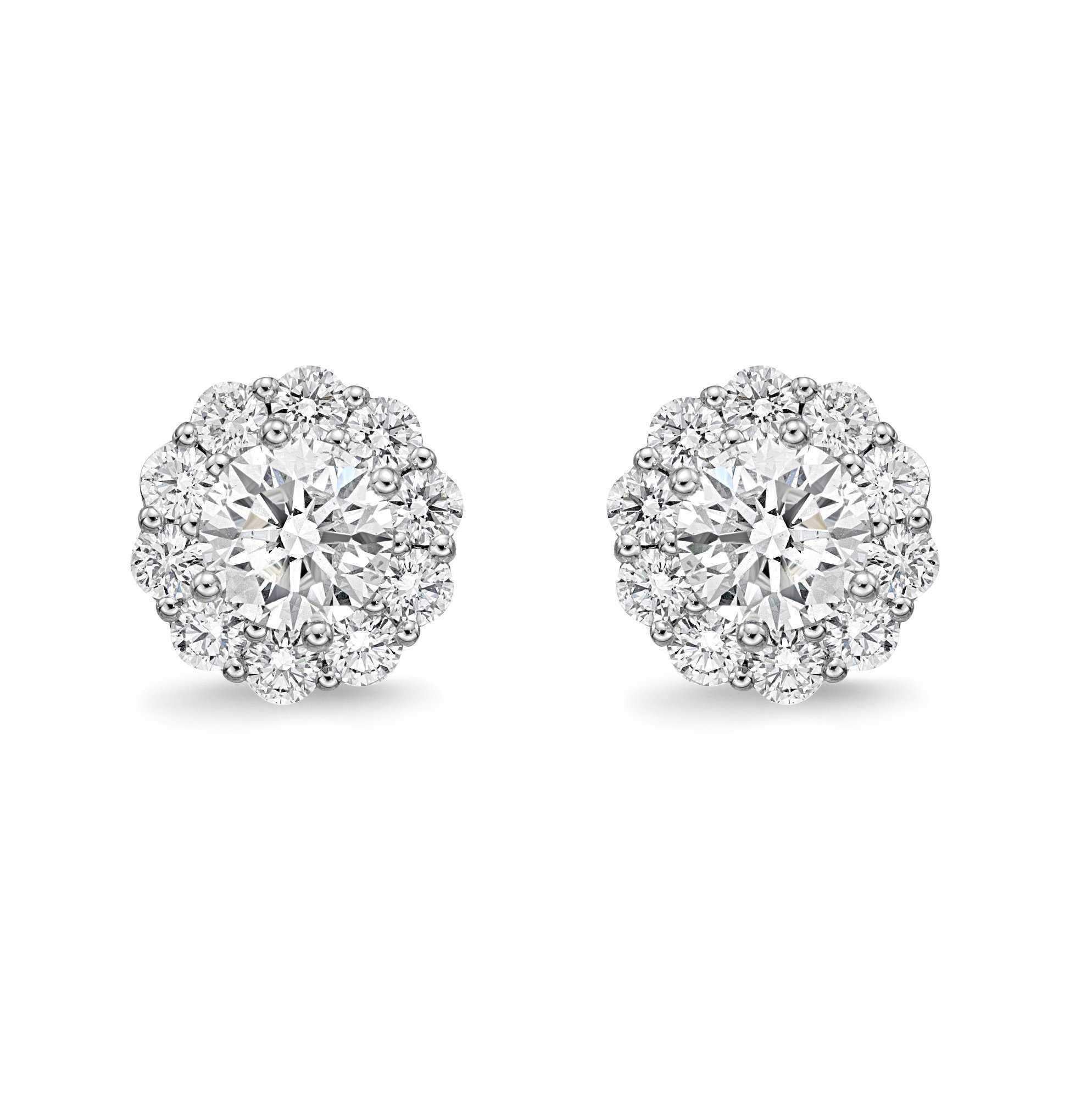 The Memoire Blossom Collection Diamond Earrings feature 22 diamonds with a combined weight of 1.52cts t.w., set in 18K White Gold. With a G-H Color and SI1 Clarity, these earrings offer an Ideal Cut and measure 9mm in diameter.