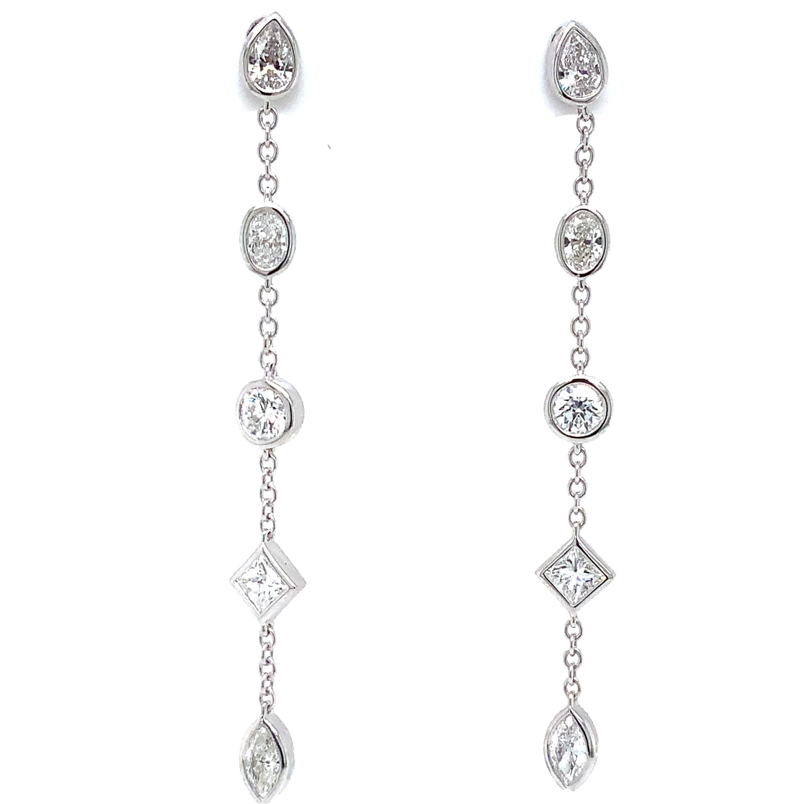 Memoire's Cascade Mixed Cut Fancy Shaped Diamond Drop Earrings are crafted from 18K White Gold. This chic, modern design makes a stunning addition to any jewelry collection. These earrings feature 10 bezel-set diamonds totaling 1.00 ct t.w.,