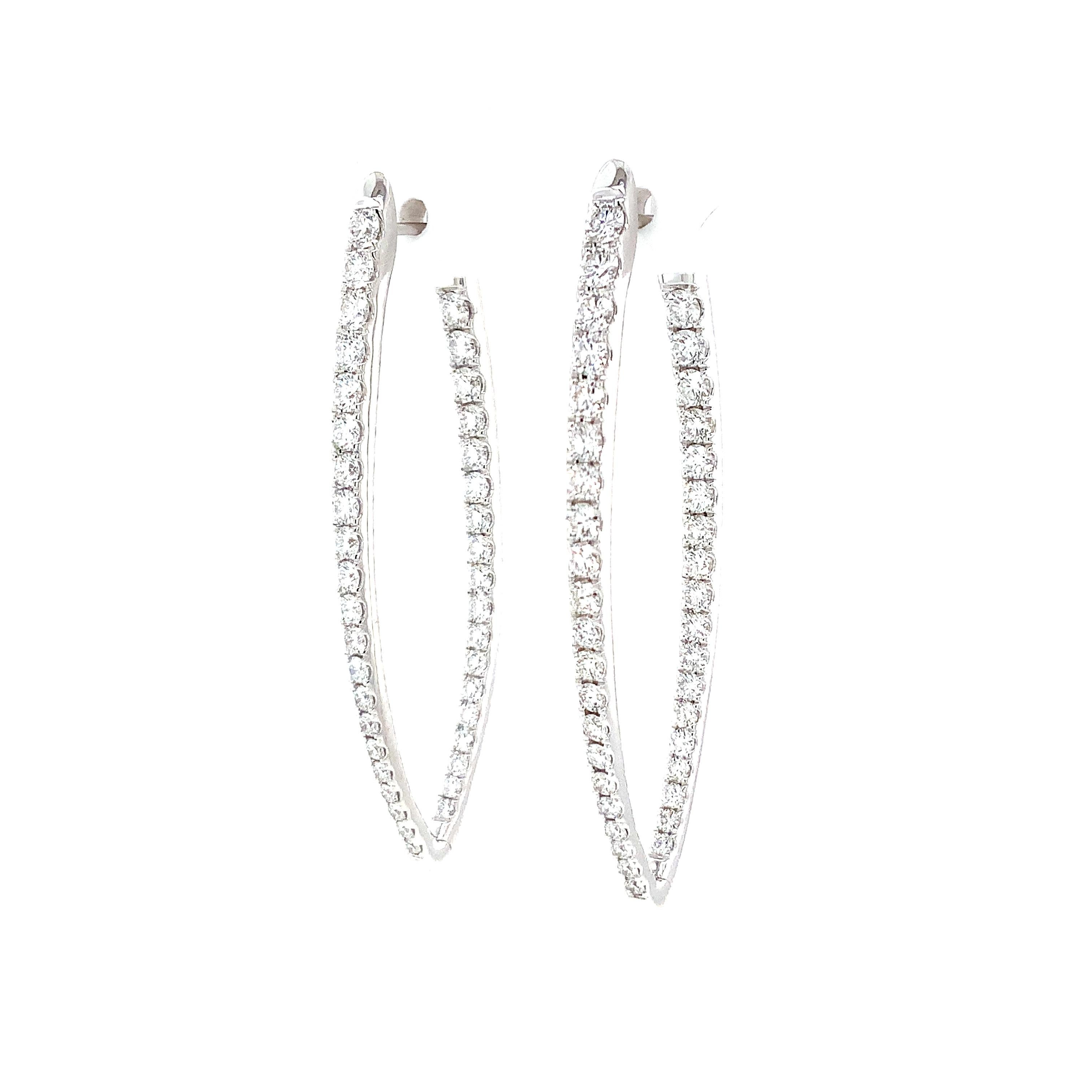 This Memoire Imperial Collection Diamond Hoop Earring Set is crafted from 18K White Gold, containing 78 Diamonds that total 2.46 carats. Of F-G Color, these Diamonds have a VS1-SI1 Clarity, with a diameter of 47mm and a width of 16mm. This Earring