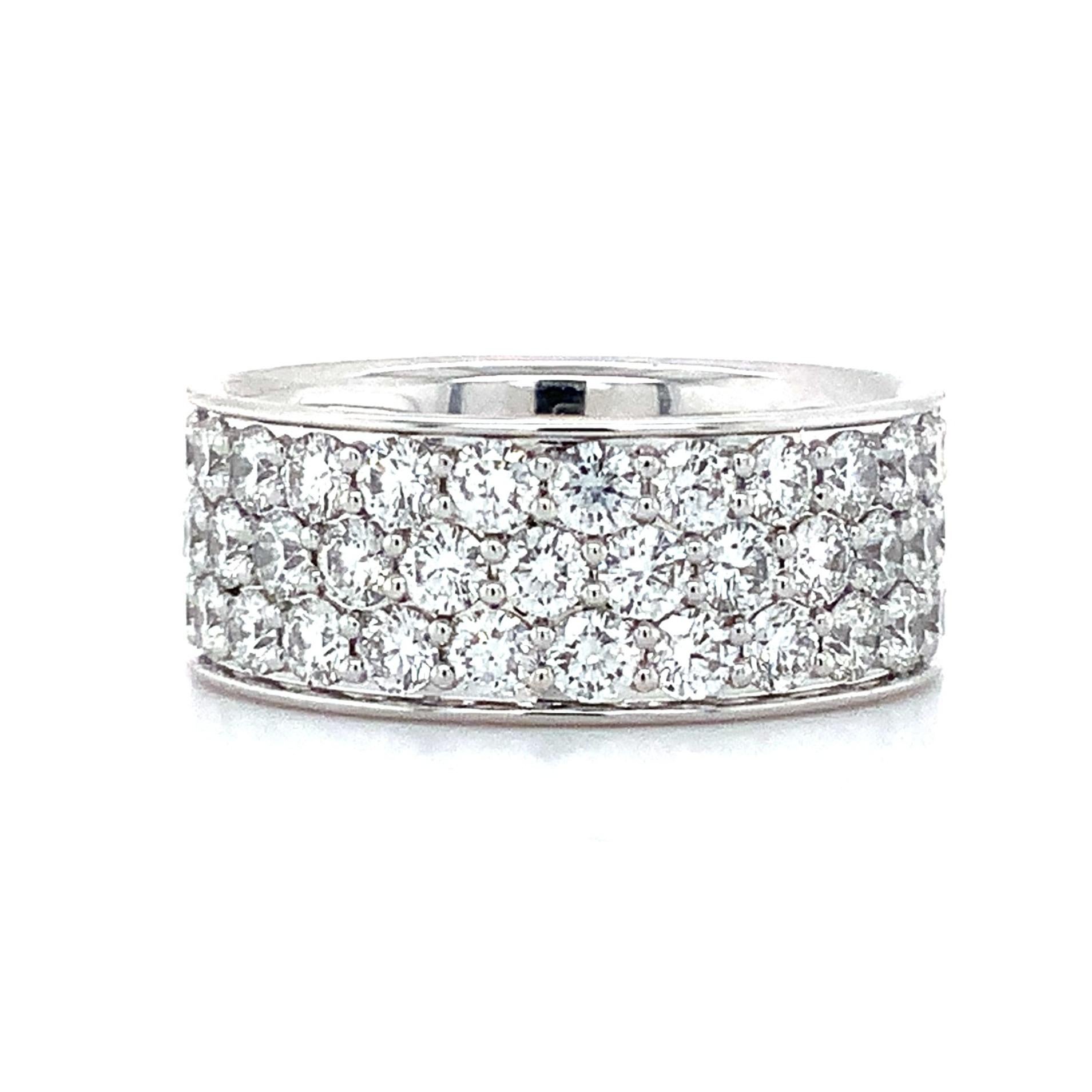 This stunning Memoire Collection Pavé Silk Half Round Diamond Band features 46 magnificent Round Brilliant Cut Diamonds totaling 2.27 carats. Hues of F Color and VS1 Clarity are complemented by an Excellent Make and Polish, while an 8.05 mm width
