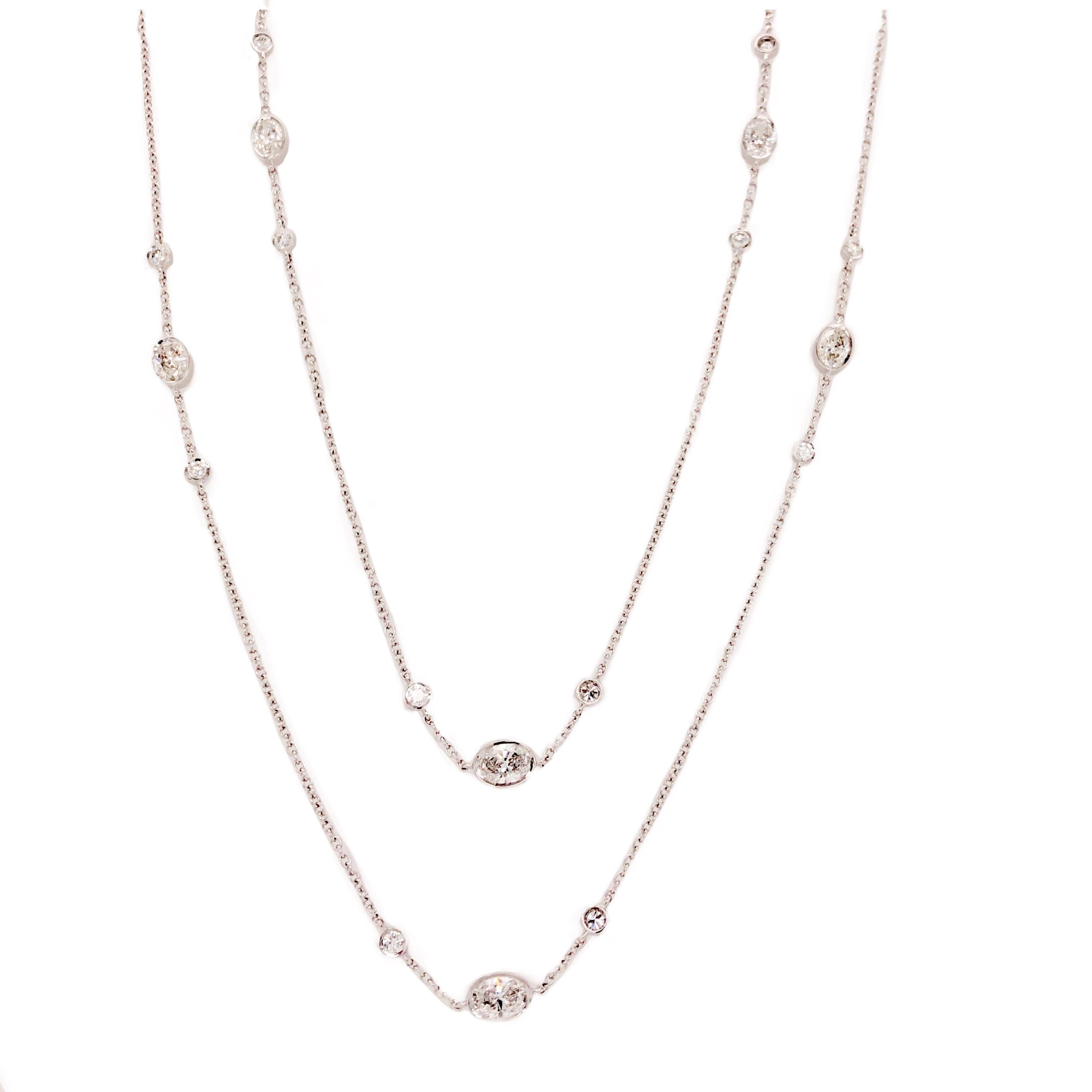 Memoire Diamonds By The Yard Necklace Oval and Round Diamond Chain 2.27 ctw 18K W/G. This Memoire 18K White Gold Diamonds By The Yard Chain Necklace features 24 Oval and Round Brilliant Diamonds equalling 2.27 Carats in Total Weight. These Diamonds
