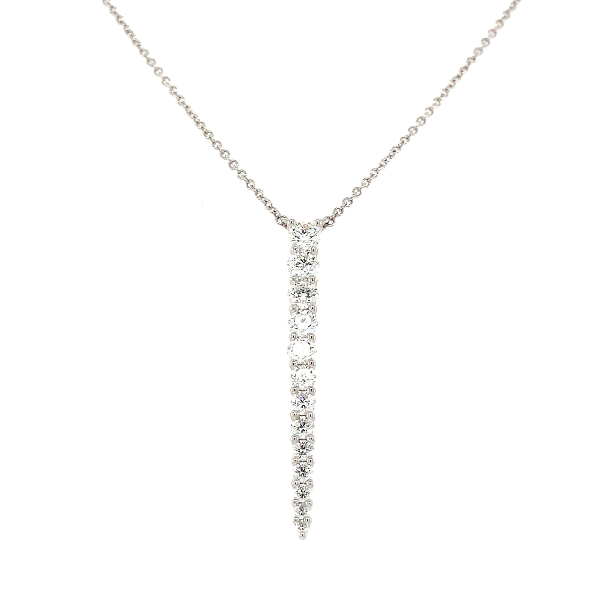 This elegant Diamond Pendant from the Memoire Identity Collection, set in 18K White Gold, features 12 Round Brilliant Cut Diamonds, graded F-G in Color and VS in Clarity, totaling 1.20 ct. of weight. Its professional craftsmanship is evidenced by
