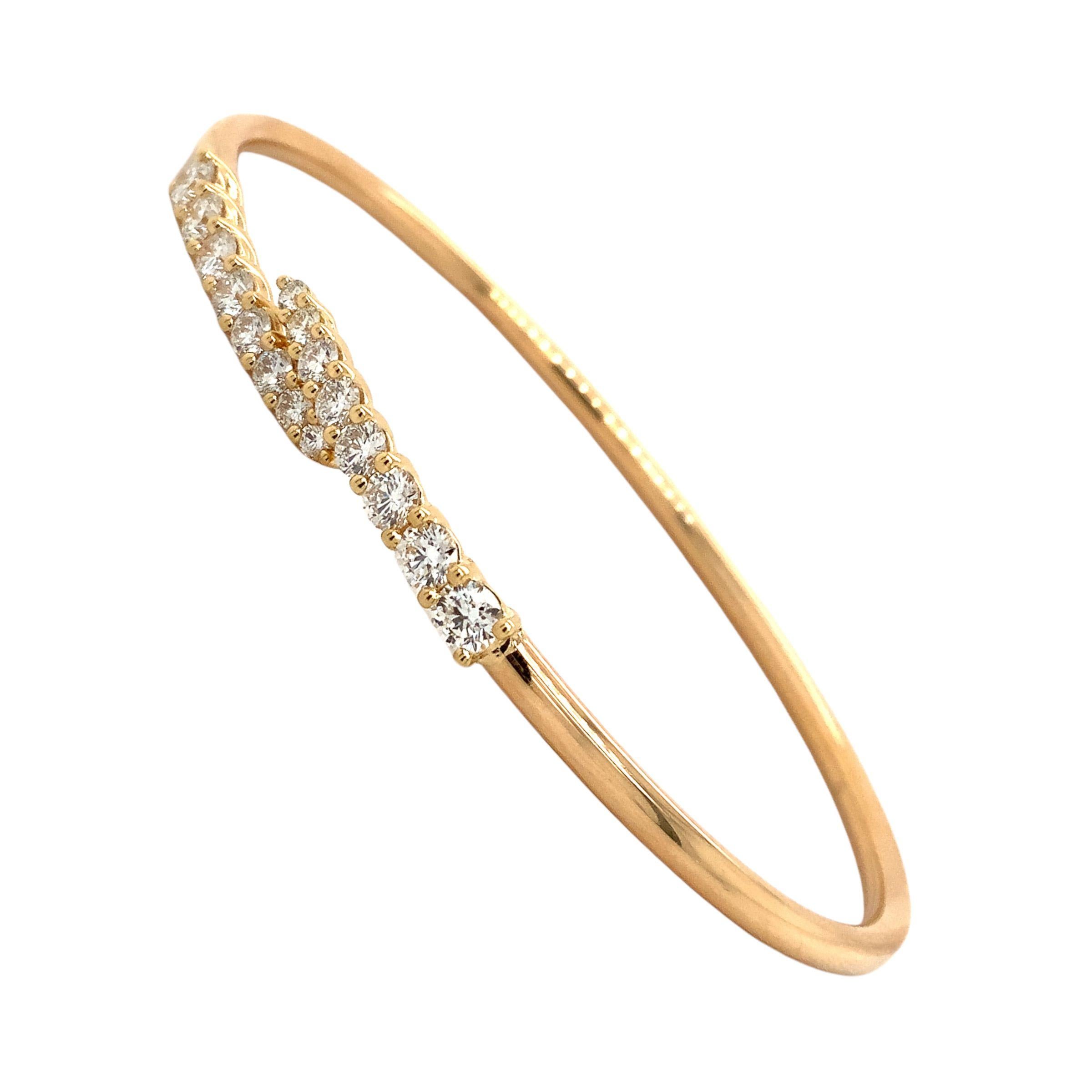 This Memoire Identity Collection Flexi Diamond Bangle is crafted from 18K White Gold and features sixteen Round Brilliant Cut Diamonds, graduating in size for a total carat weight of 1.12ct tw. with F-G Color and VS Clarity for remarkable sparkle