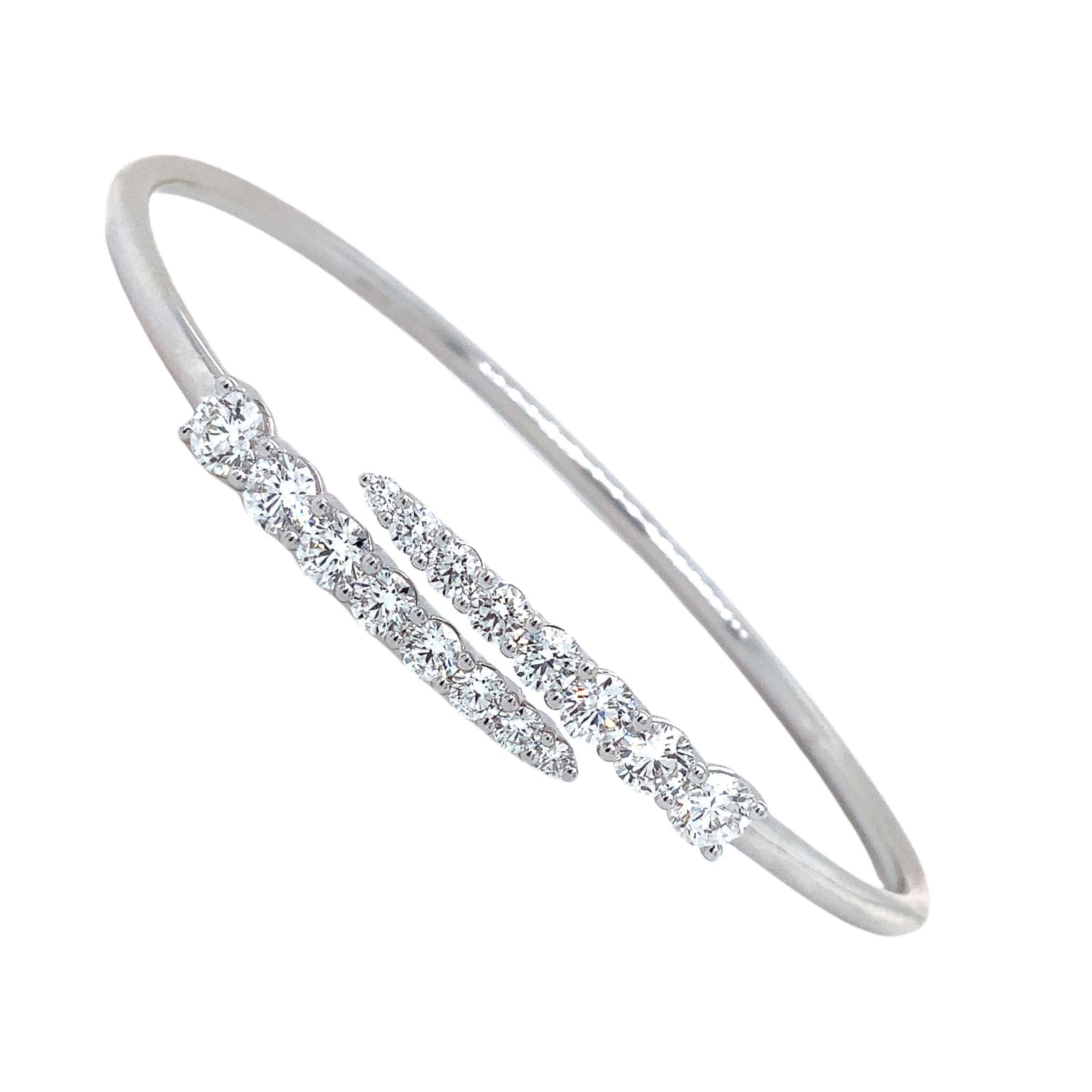 Memoire Identity Collection Flexi Diamond Bangle18K White Gold 
16 Round Brilliant Cut Diamond Graduating in size equalling 1.95ct. tw. 
F-G Color VS Clarity 
Excellent Make and Polish
7.20 grams in weight