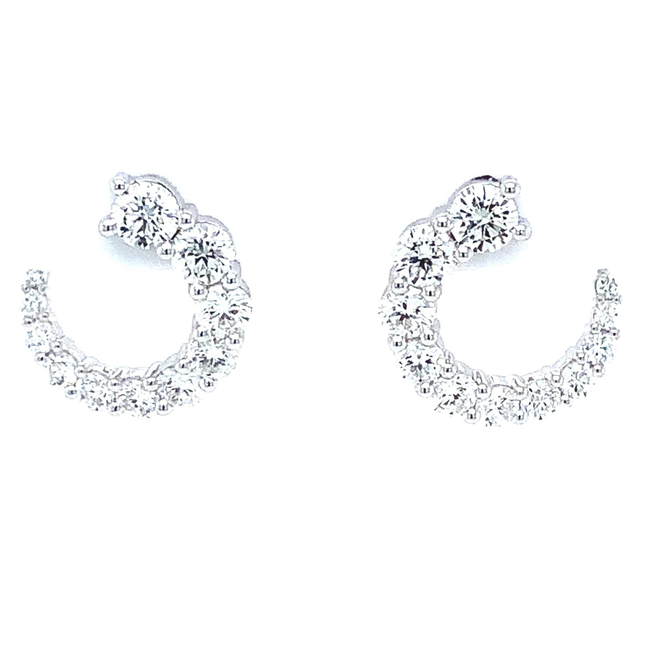 The Memoire Luna Wrap Collection Diamond Earring with 18Karat White Gold features 22 Round Brilliant Cut Diamonds with a total carat weight of 1.30cts t.w., exhibiting F-G in Color, VS1 Clarity, Ideal Make and Polish, a diameter of 11.90mm x 9.06mm,