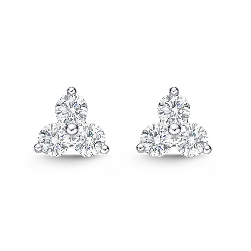 Memoire Trinity Collection 3 Stone Studs feature 6 stunning round brilliant diamonds totaling 0.91 ctw. With F color and VS1 clarity, these earrings have a diameter of 7.30 mm and a weight of 2.6 grams.