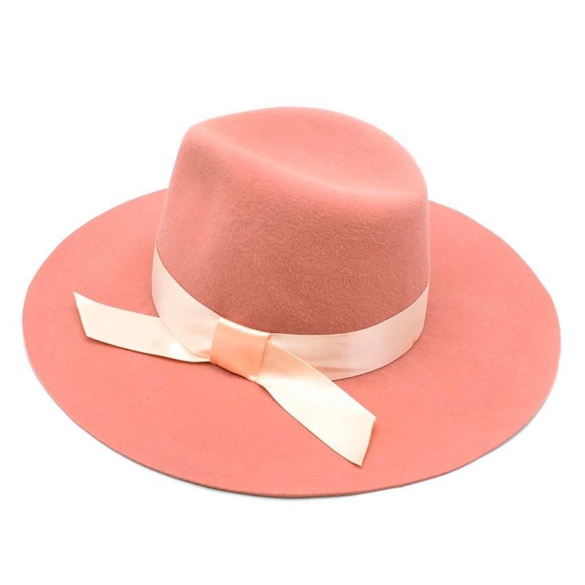 Memoria Hats Rabbit Fur Pink Wide Brimmed Hat

- Pink wide brimmed wool hat
- Soft brim
- Bow tie satin hat band wrapped around the circumference of the hat
- Rabbit felt
- Handmade in Italy

Please note, these items are pre-owned and may show some