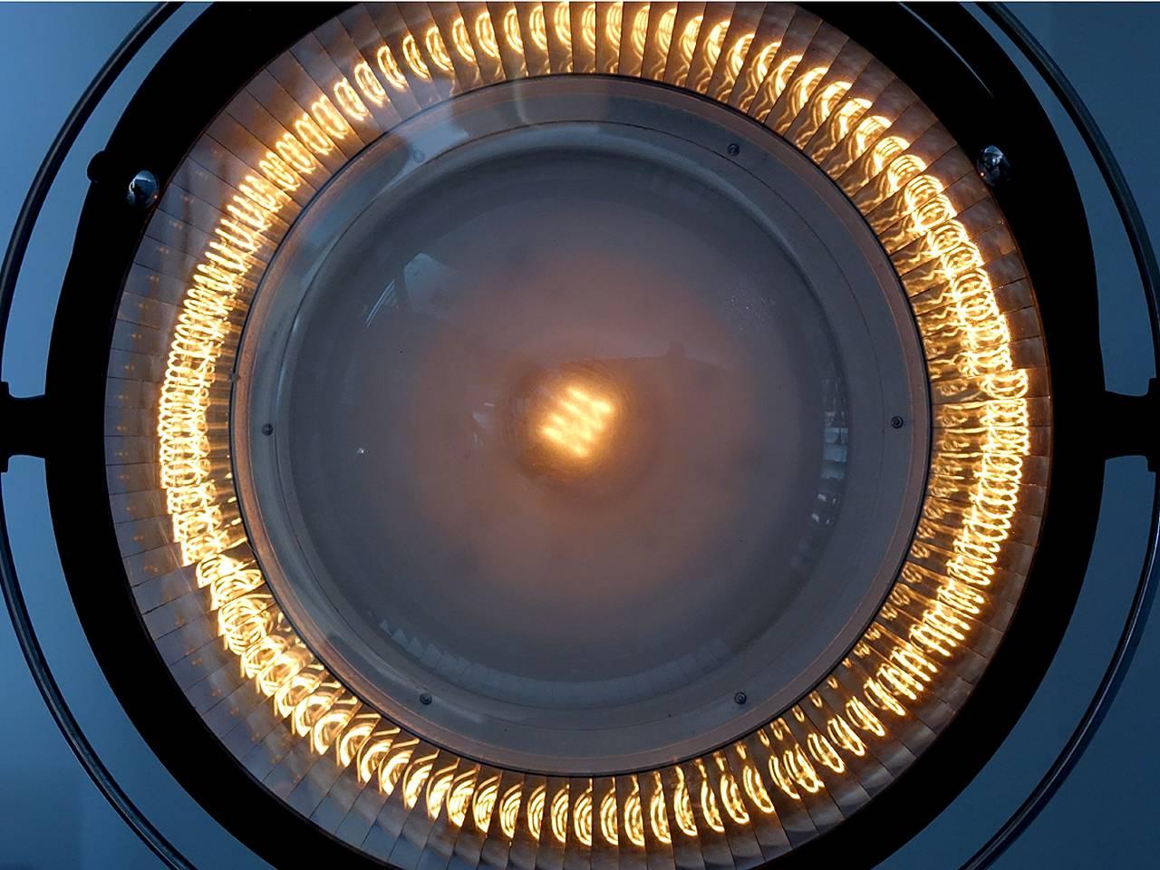 These rare French Scialytique operating room lamps are very difficult to find. There are almost 100 individual hand fitted mirrors in each. It all surrounds a single Edison light bulb. The amplified light produced by this combination must be seen.