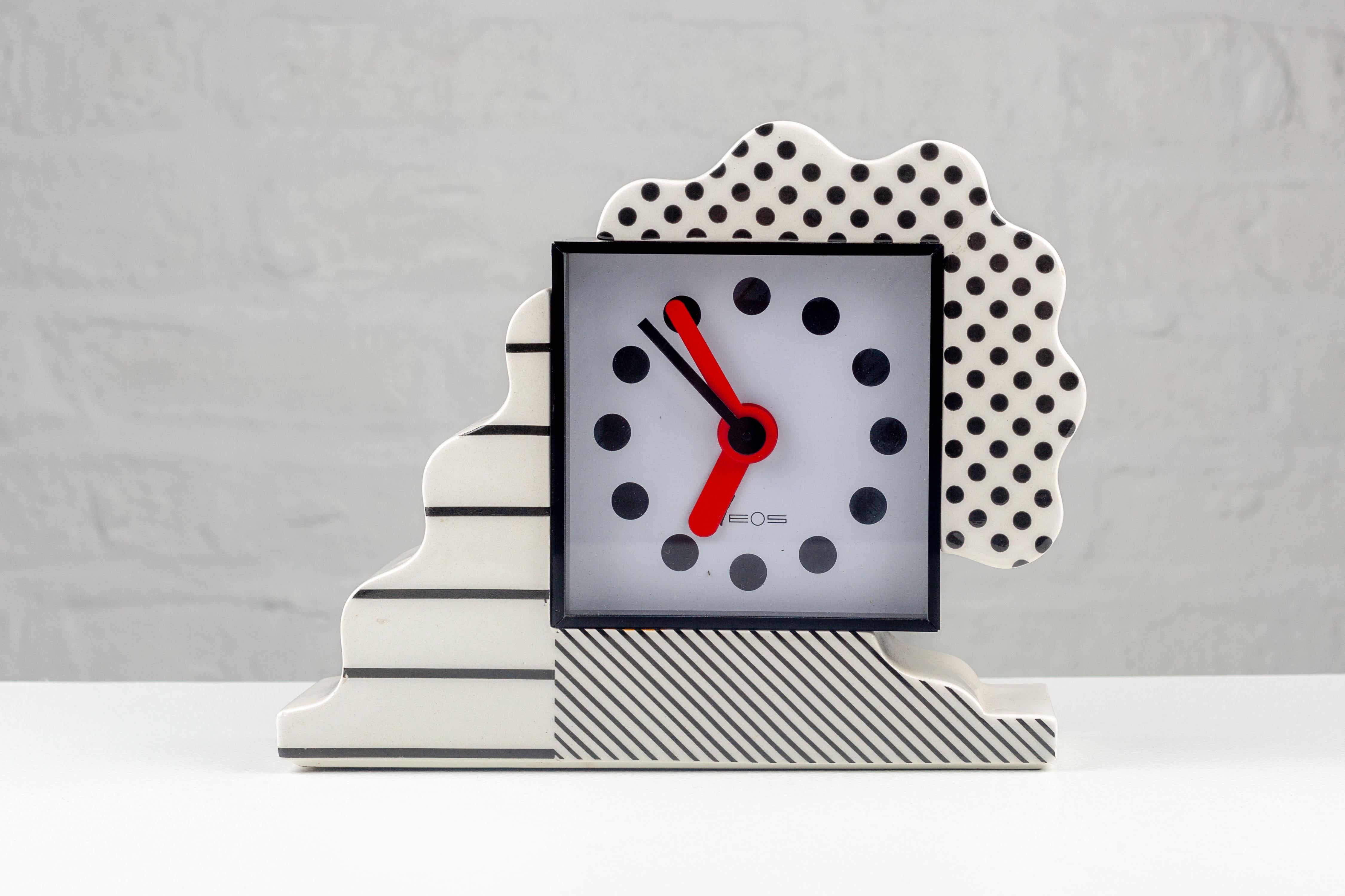 Created by Nathalie du Pasquier and George Sowden for Neos Lorenz in 1988 Italy, this ceramic table clock, with its bold shapes and patterns, is an excellent example of 1980s design.

The porcelain is crafted by Alessio Sarri, renowned for his
