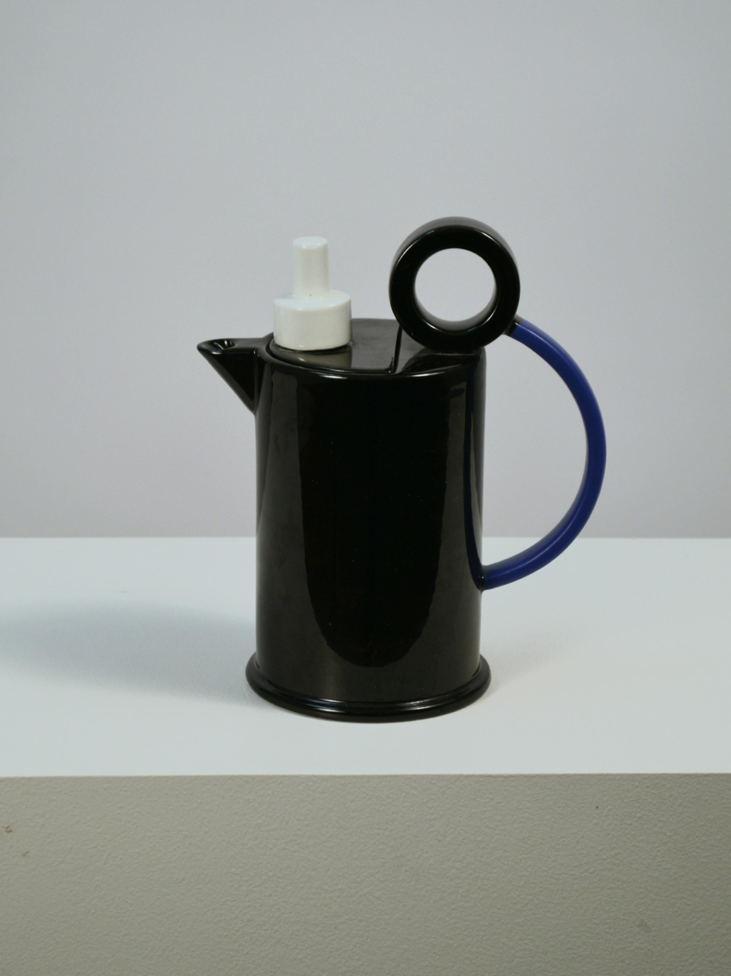 Tall Memphis style creamer designed by Marco Zanini for Bitossi, Italy in the 1980's. This functional piece of art features a locking fitted lid and sturdy handle design. It is part of a series of functional pieces designed by Zanini for Bitossi.