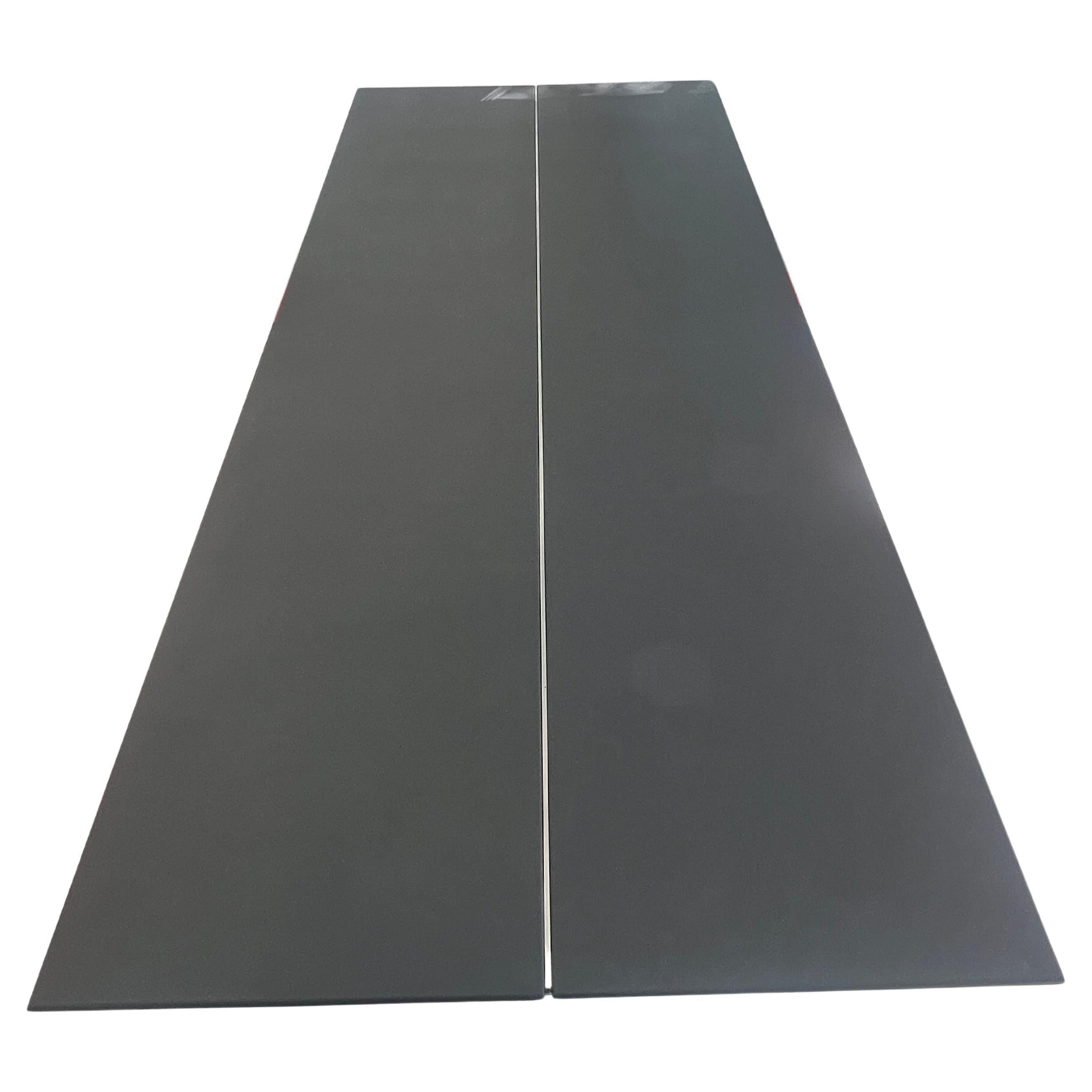 Rare Dining table from the 1980's Memphis movement with Italian Carrara marble uprights and steel elements. very rare piece striking and unique in great condition the top is solid material with a cross bar steel bar a one of a kind piece.