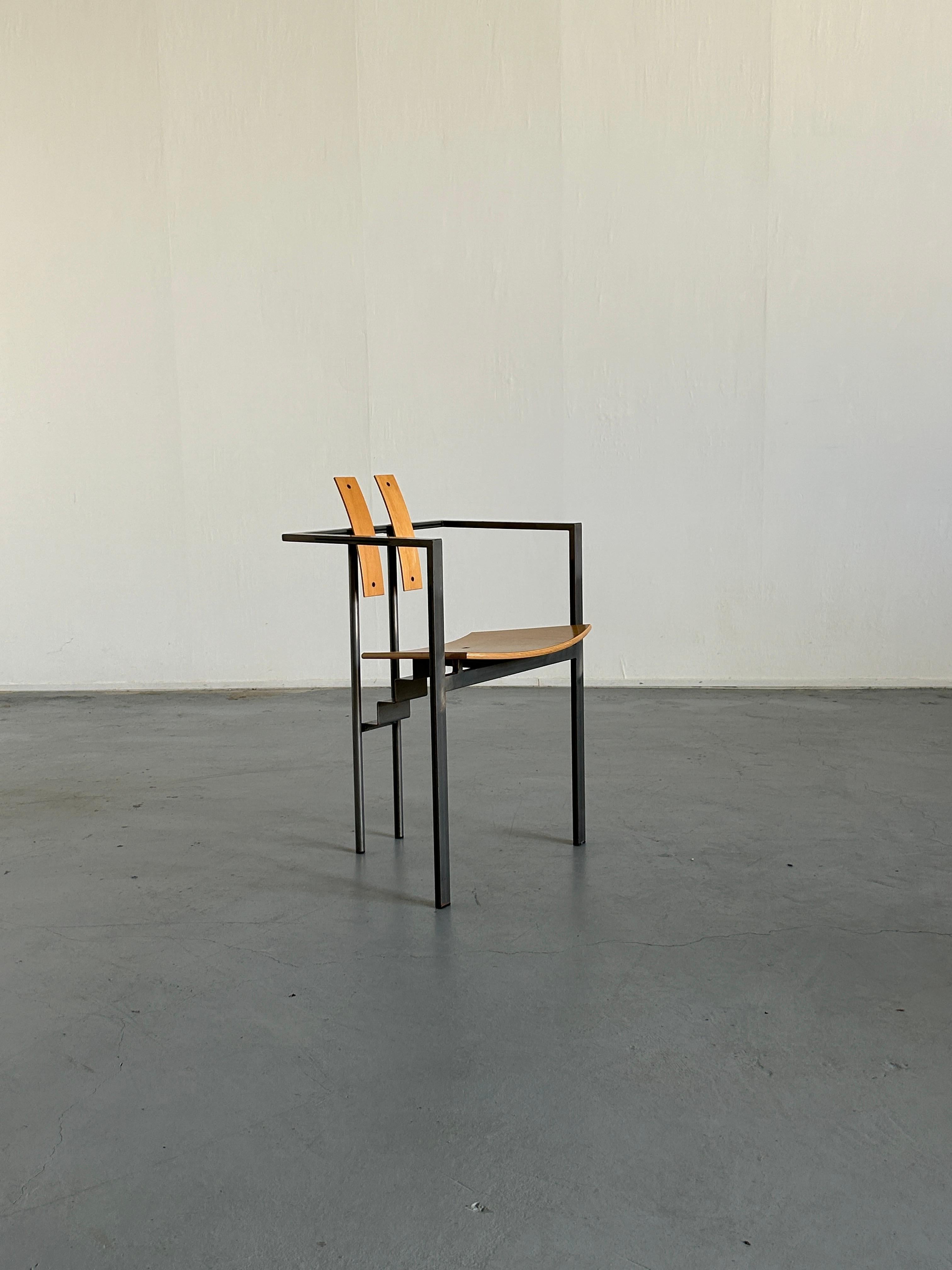A steel and plywood postmodern 'Trix' chair designed in the 1980s in Germany by Karl Friedrich Förste for KFF, his own manufacturing company. Unique, geometrical and Memphis-influenced design. 

Overall very well preserved and in excellent vintage