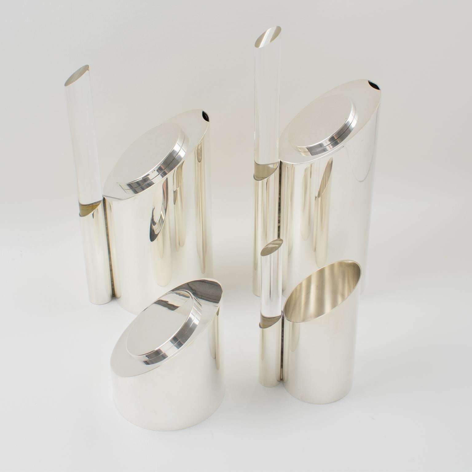 A sophisticated French modernist Memphis-style coffee or tea serving set. The set features a coffee pot, teapot, creamer, and sugar pot with a sculptural polished silver plate metal body and clear Lucite or acrylic thick rod handles. This