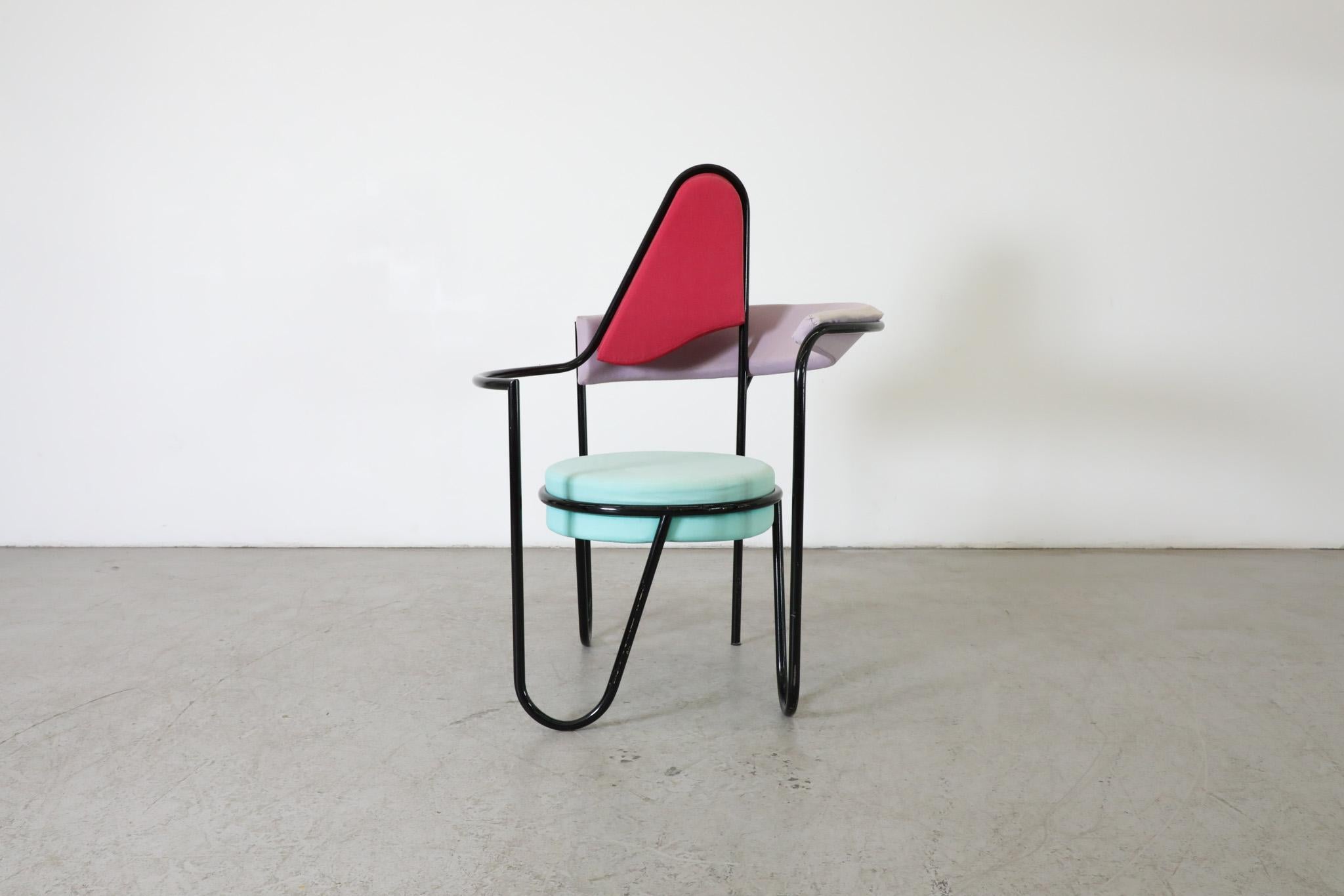 This Dutch, 1980's “Memphis” style chair is comprised of vividly colored geometric forms and and grounding, black frame and strikes a playful balance in its colors and shapes. Memphis Design is sometimes referred to as the result of a wild night
