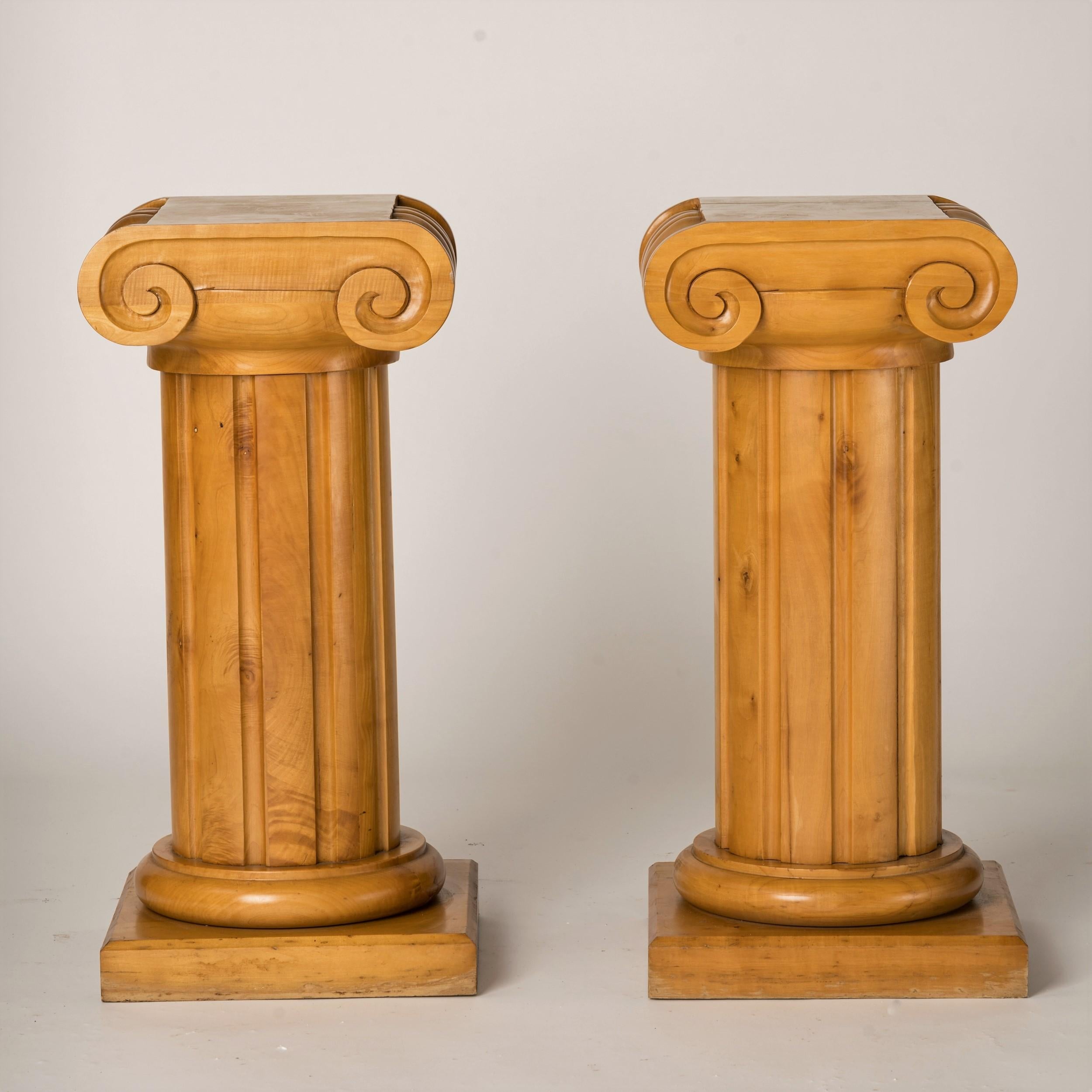 Unique pair of graphic solid wood pedestals of gueridons. Extremely heavy. Could be used either as pedestals or as gueridons or bouts de canapés. In good vintage condition. Some varnish losses and minor structural damages as shown on
