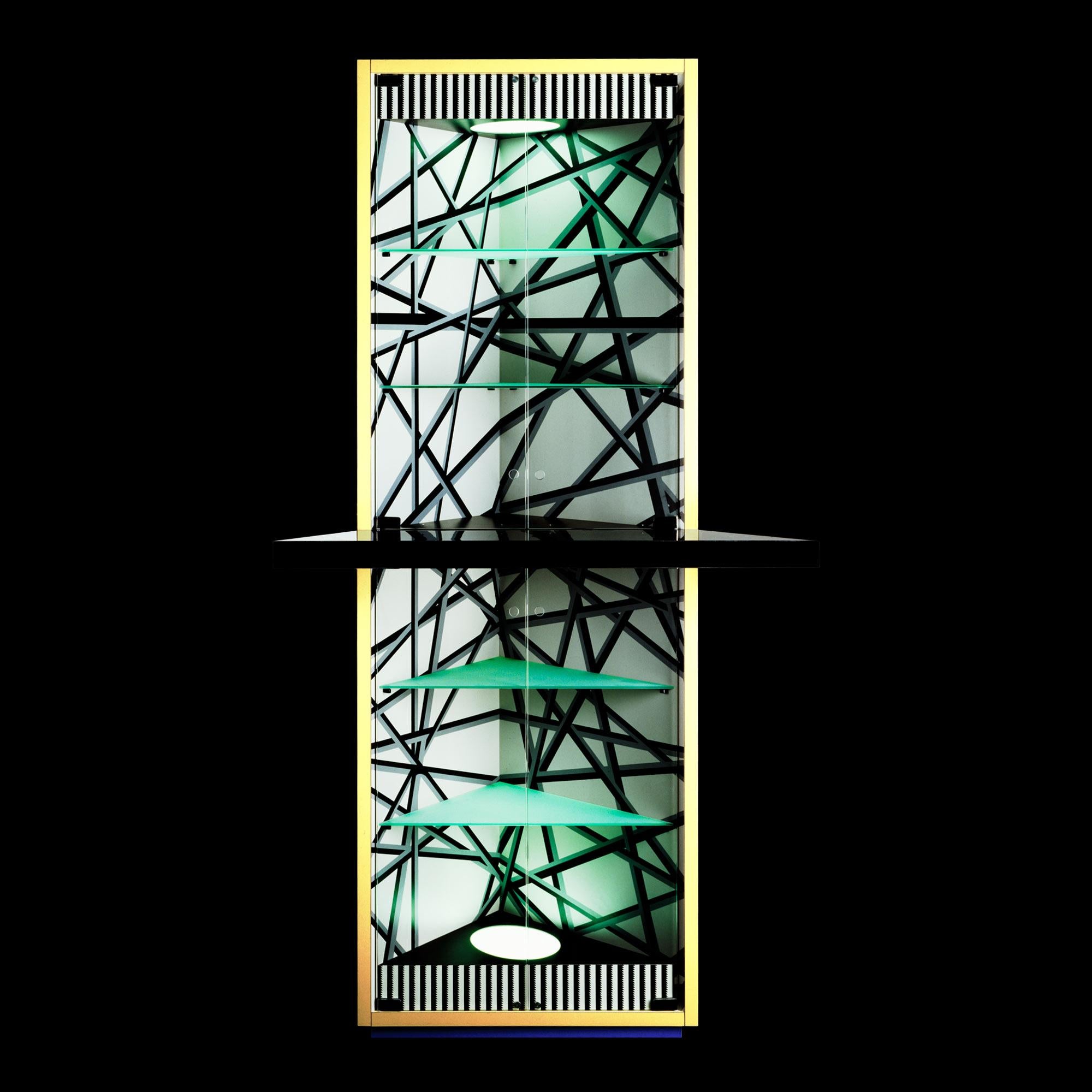 MADRID Corner Cabinet
Collection: Memphis Milano
Designer: Michele De Lucchi
Year: 1986
Corner cabinet in plastic laminate with glass doors and inside lights.
Size: W 120, D 58, H 220 cm
The product is purchased with authenticity certificate and