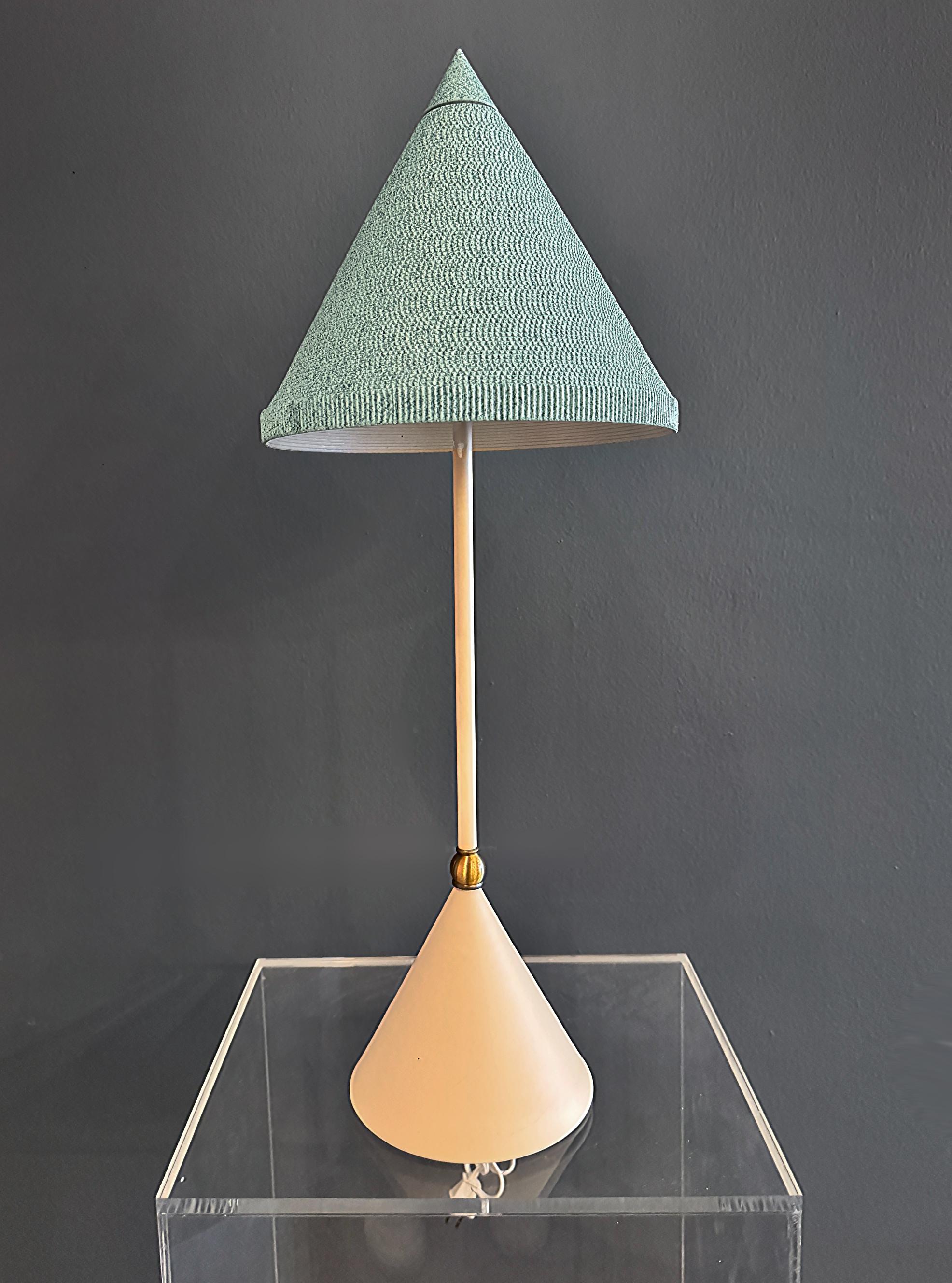 Memphis Milano Style Lamp, Original Cardboard Conical Shade


Offered for sale is a Memphis Milano-style table lamp with the original cardboard conical shade. Its base and stem are made with a warm cream-finished metal and contains a brushed brass
