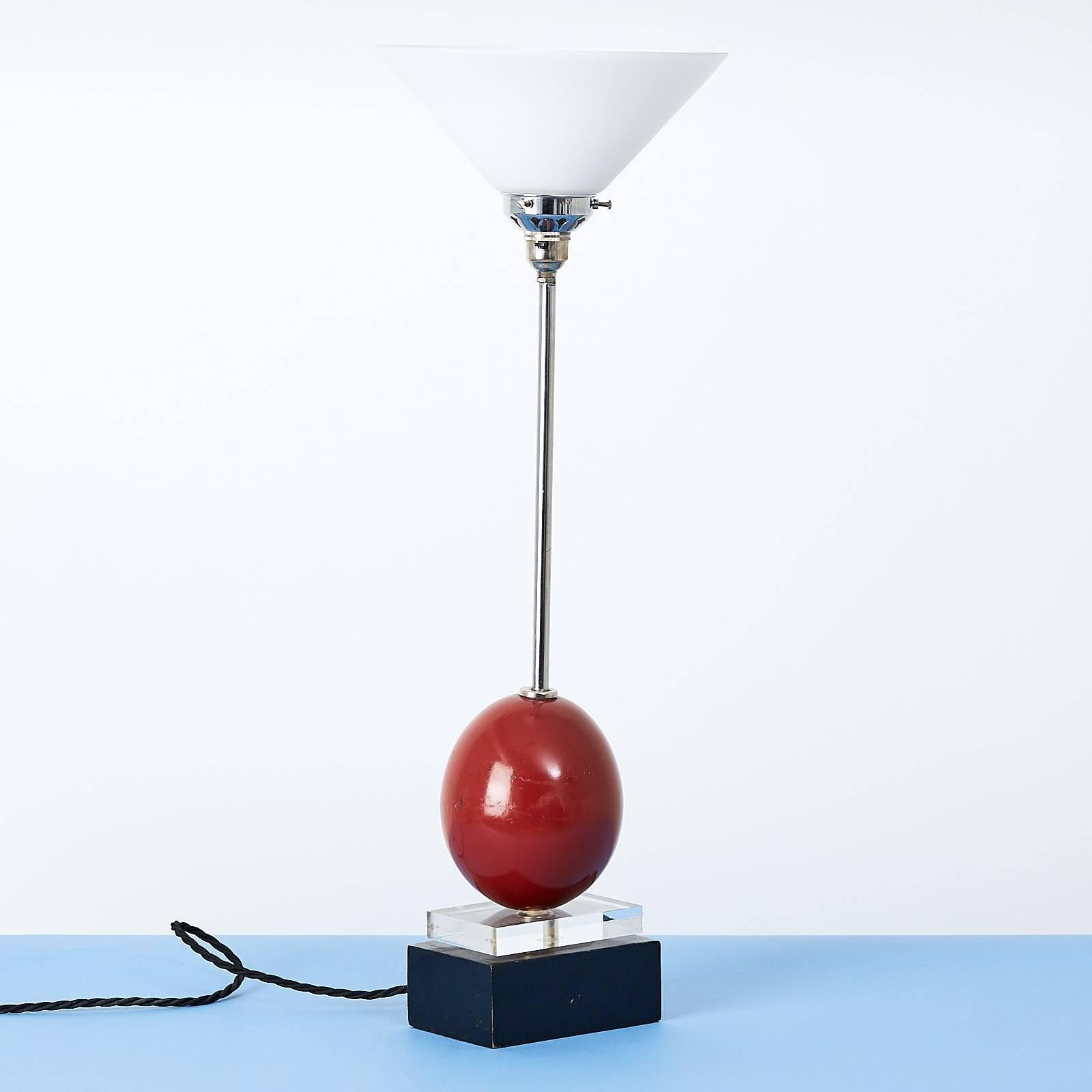 A Post-Modern table lamp, the chrome-plated stem with perspex and lacquered wood base, Italian, 1980s.
