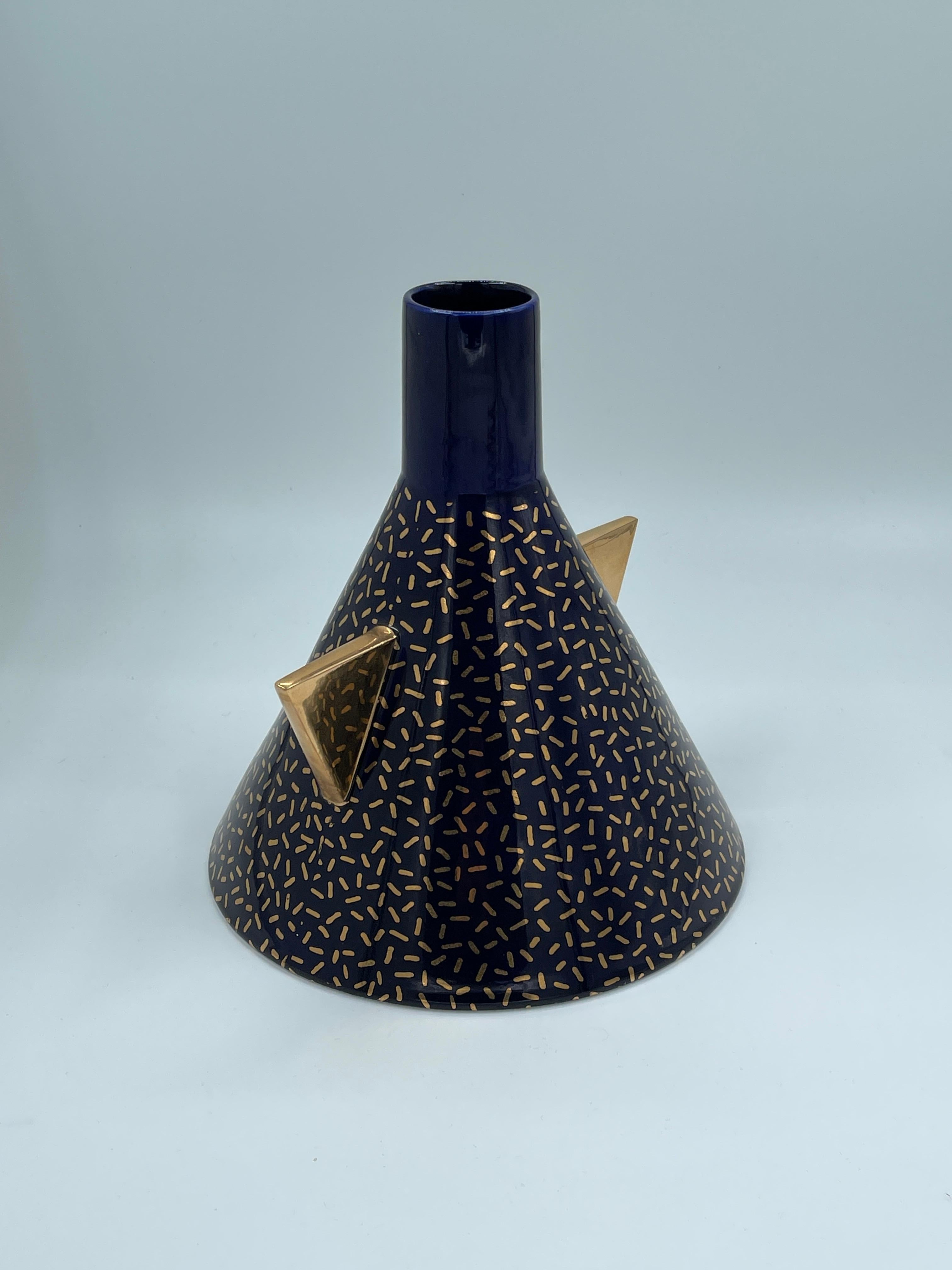 Hand-turned and hand-painted ceramic vase with kiln-sublimated decorative decals.

Teje vase for Memphis Milano by Matteo Thun, Italy, 1981. Very good condition with no chips cracks or repairs.

vase: 24 × 23 cm

Stamped manufacturer's mark to