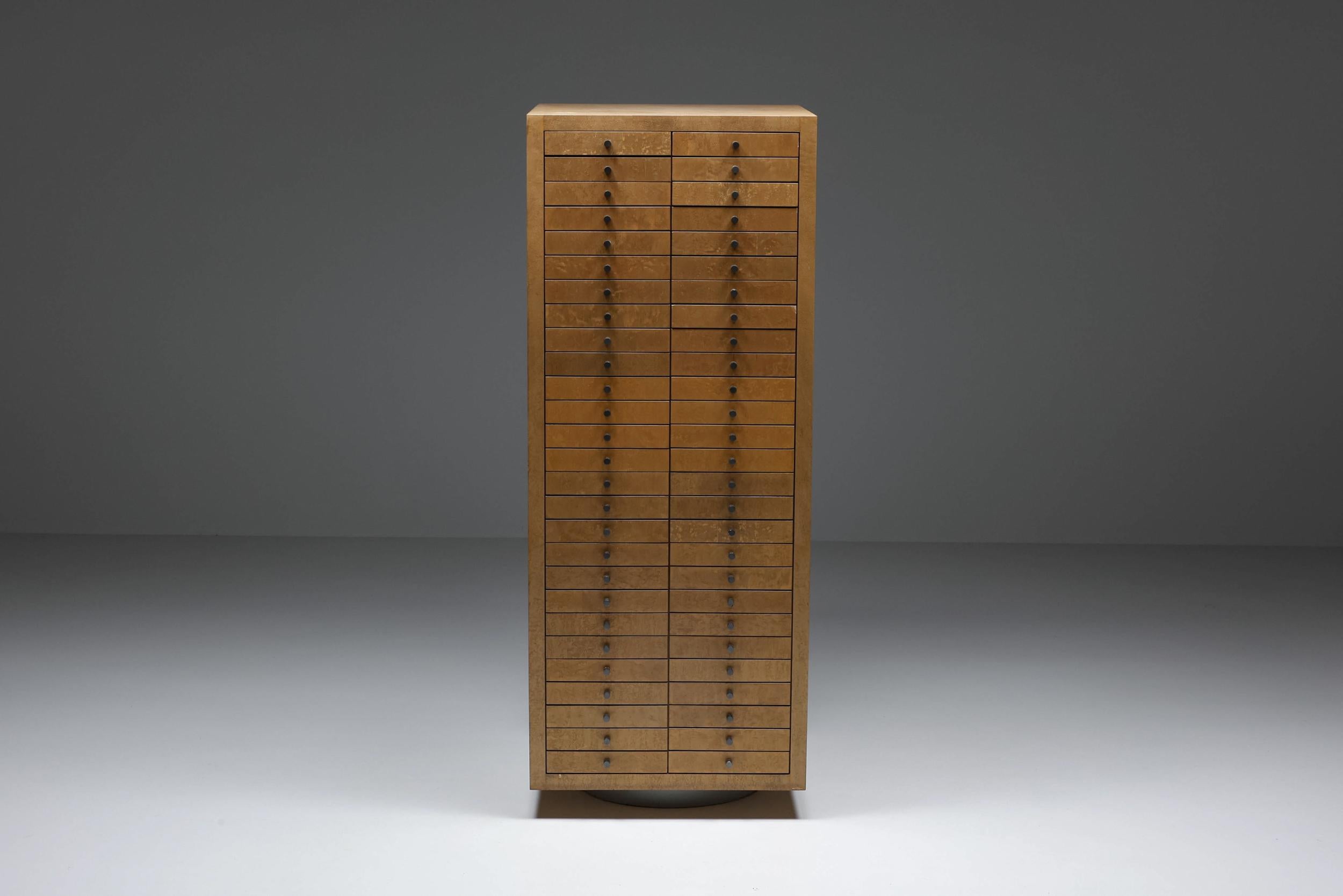 Birdseye maple; multi-tech xl high board with drawers; metal multi-drawer cabinet, Frans Van Praet; 1980s;

Memphis style multi-drawer cabinet with 54 drawers by Frans Van Praet. Birdseye maple veneer with anodized hammered metal handles and an