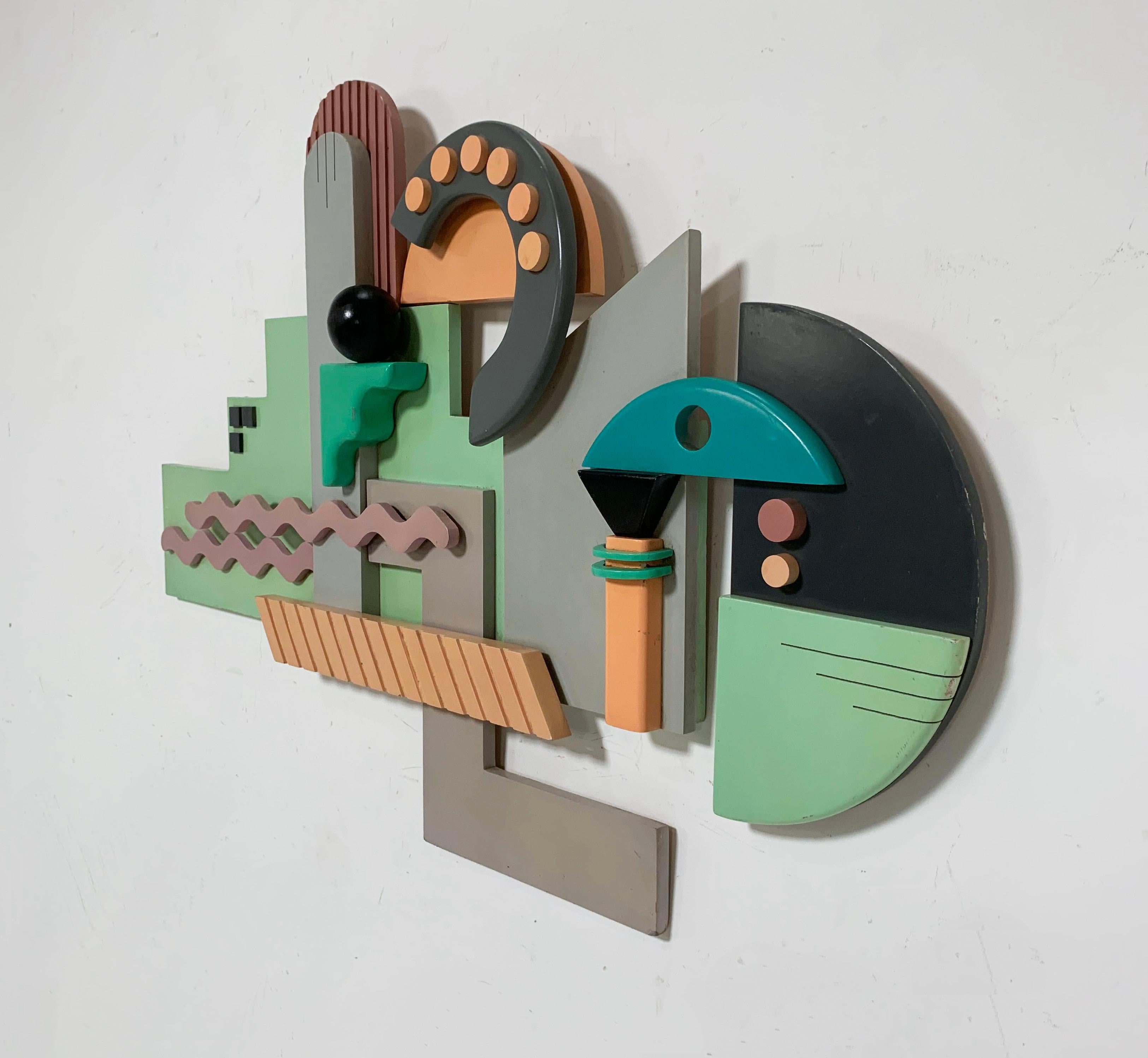 Lacquered wood wall sculpture by Bob Stimmel, numbered 9/125, circa 1980s. In the manner of the Memphis Group.