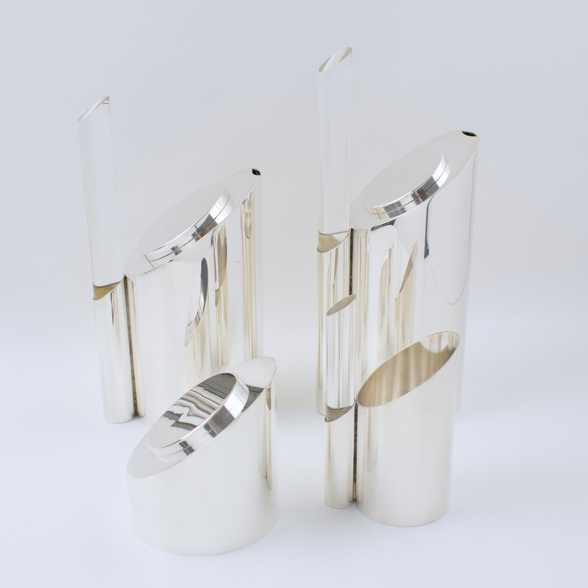 Indulge in the artistry of the Memphis Movement with this extraordinary coffee and tea service, a rare, expertly crafted creation by renowned silversmith Guildart, Paris, circa 1980. A true collector's gem, this sculptural ensemble seamlessly blends