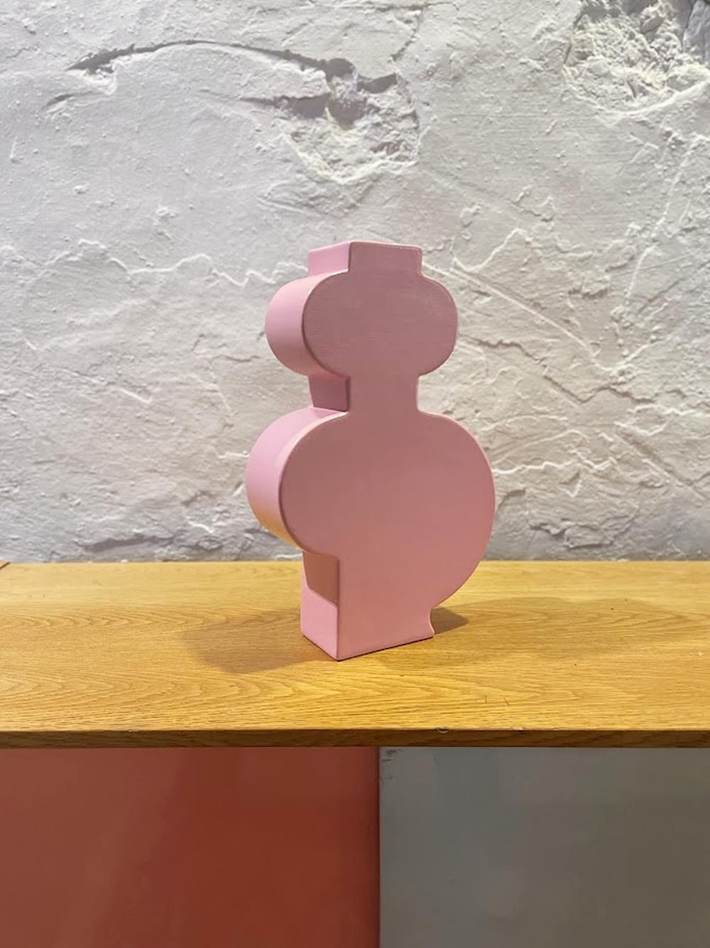 Bold, joyful and unapologetically artistic — this Memphis-style ceramic vase by Florio Keramia captures everything we love about postmodern Italian design. The striking glossy pink surface and sculptural silhouette instantly command attention,
