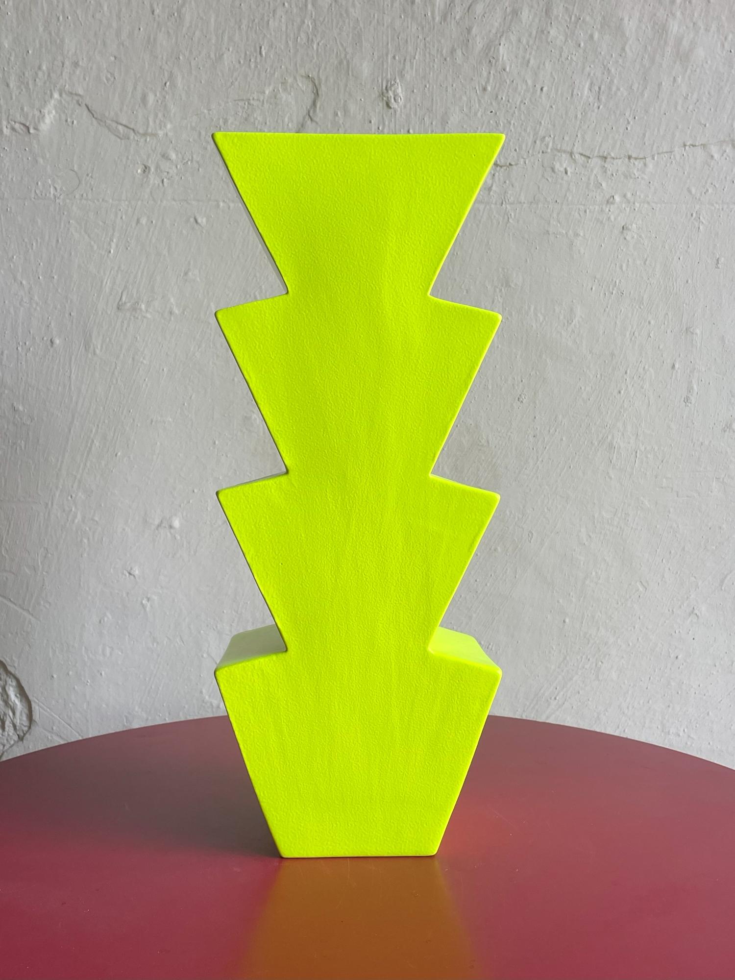 Crafted by the esteemed Florio Keramia, this Memphis Style ceramic vase named Nizza is a true embodiment of postmodern artistry. Its abstract design is complemented by a vibrant green hue and a glossy finish, creating a piece that's both a visual