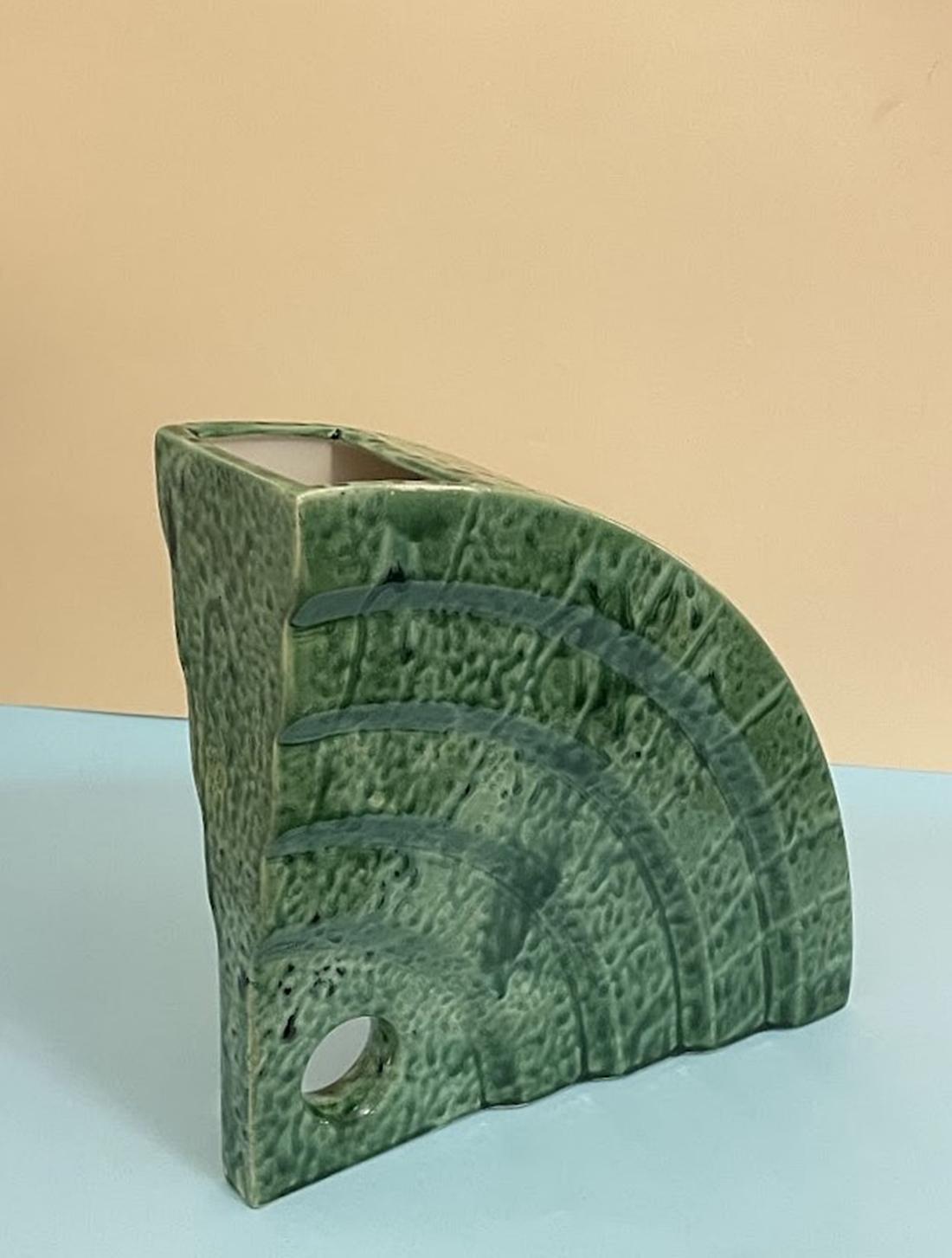 This beautiful Florio Keramia ceramic vase has an abstract pattern and a glossy finish. Original piece, handmade in the 1990s with a vintage feel. The vase is 11 cm long, 35 cm high and 35 cm wide. The green color lends a pop of color to any room,