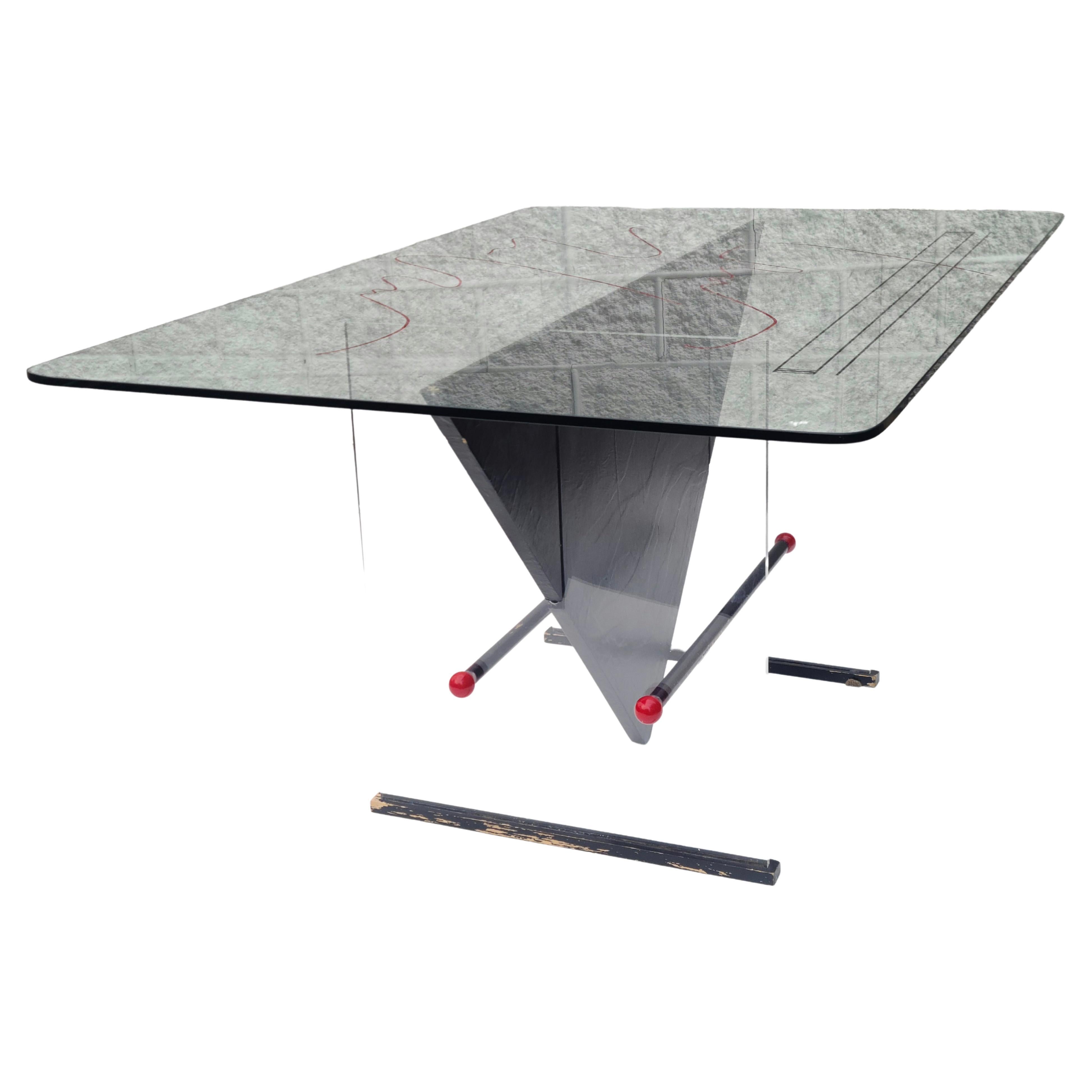 Please feel free to reach our for accurate shipping to your location.

Dining Table with Glass top on Acrylic base. Glass is etched on back side and painted in what appears to be designer's signature. Two transparent Acrylic blades on black
