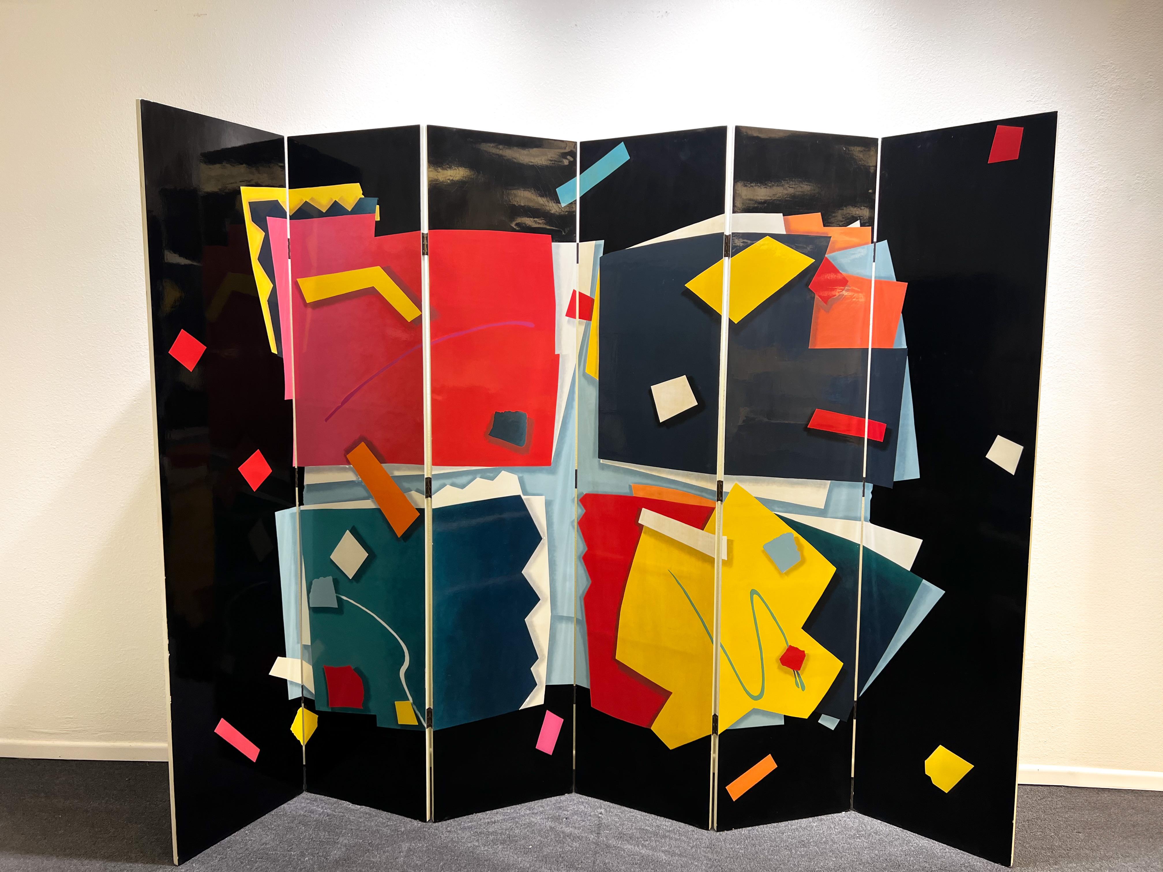 Cool 1980’s hand painted lacquer Memphis style six panel folding screen. 
In original vintage condition with minor wear consistent with age(see detail photos). 
Constructed of wood and hand painted polished lacquer. 
Measurements:
Each panel