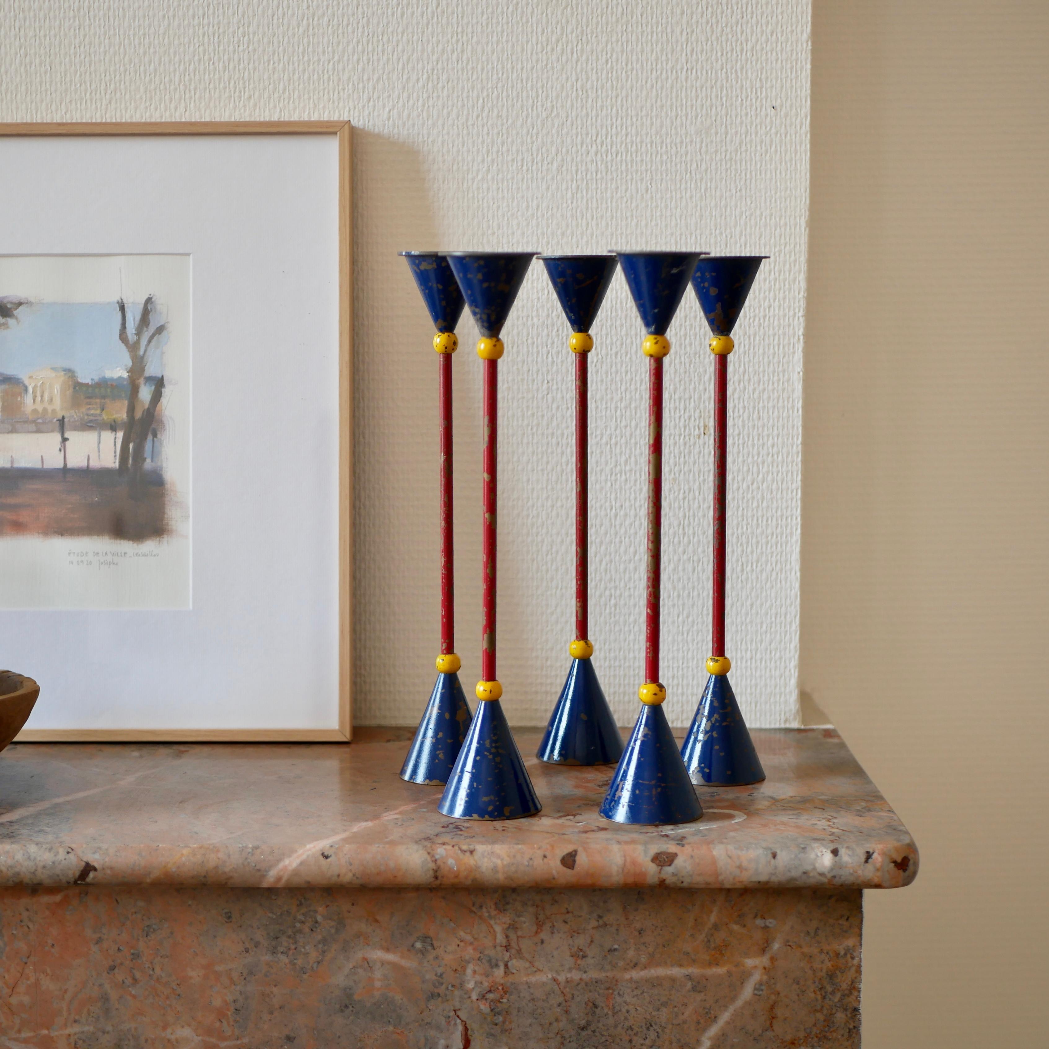 Beautiful and unique candlesticks lacquered red, yellow, blue, perfect for everyday and which will add joy to your house.
Very Memphis style design.
Beautiful patina.
Dimensions : 32cm height, 5,6cm diameter.

