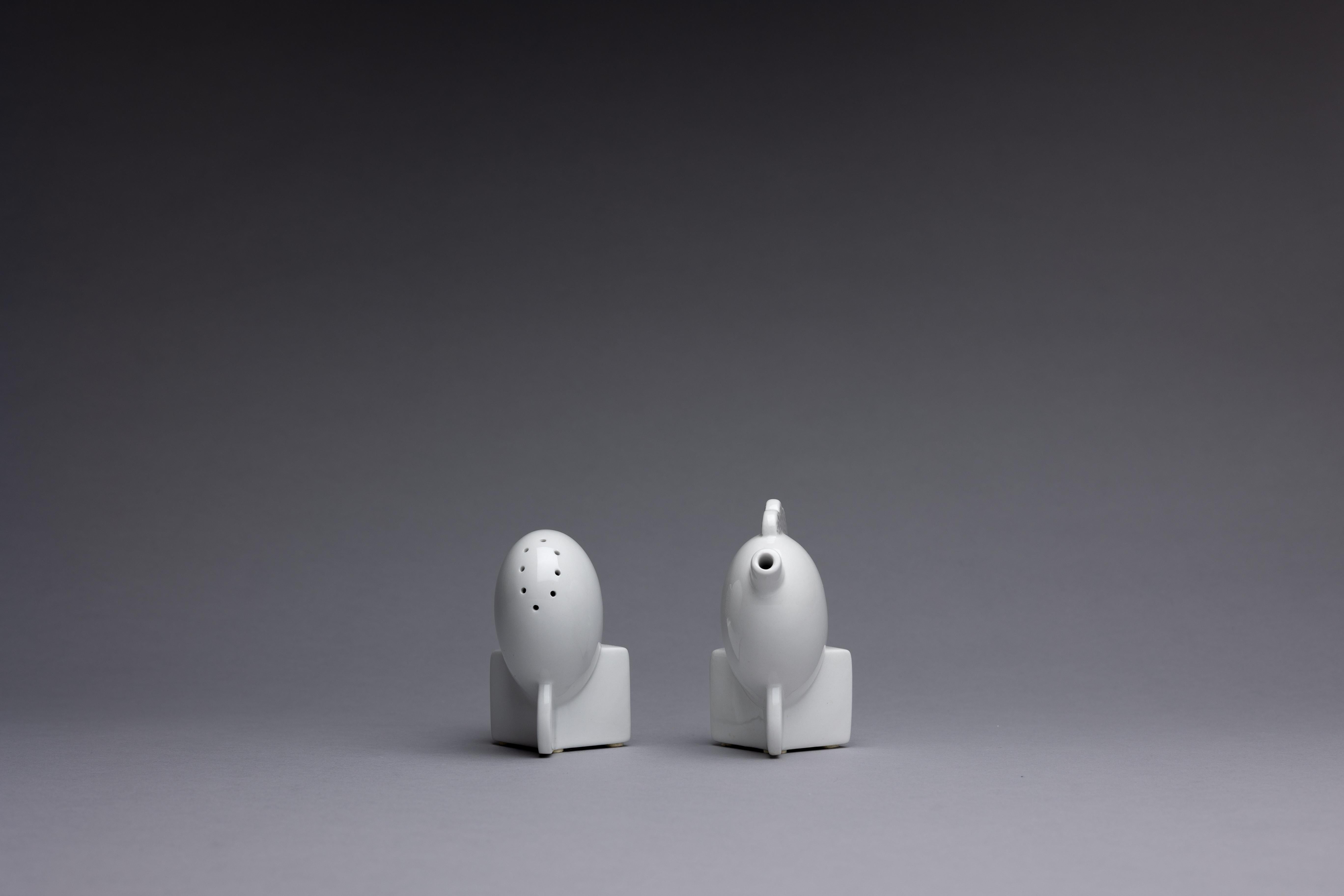 A contemporary manufacture set of porcelain Memphis-style cocktail accessories after designs by Matteo Thun in 1982 for the Memphis group. The pair comprises the 'Michigan' oil holder and the 'Erie' salt shaker.

Memphis Milano formed in the 1980s