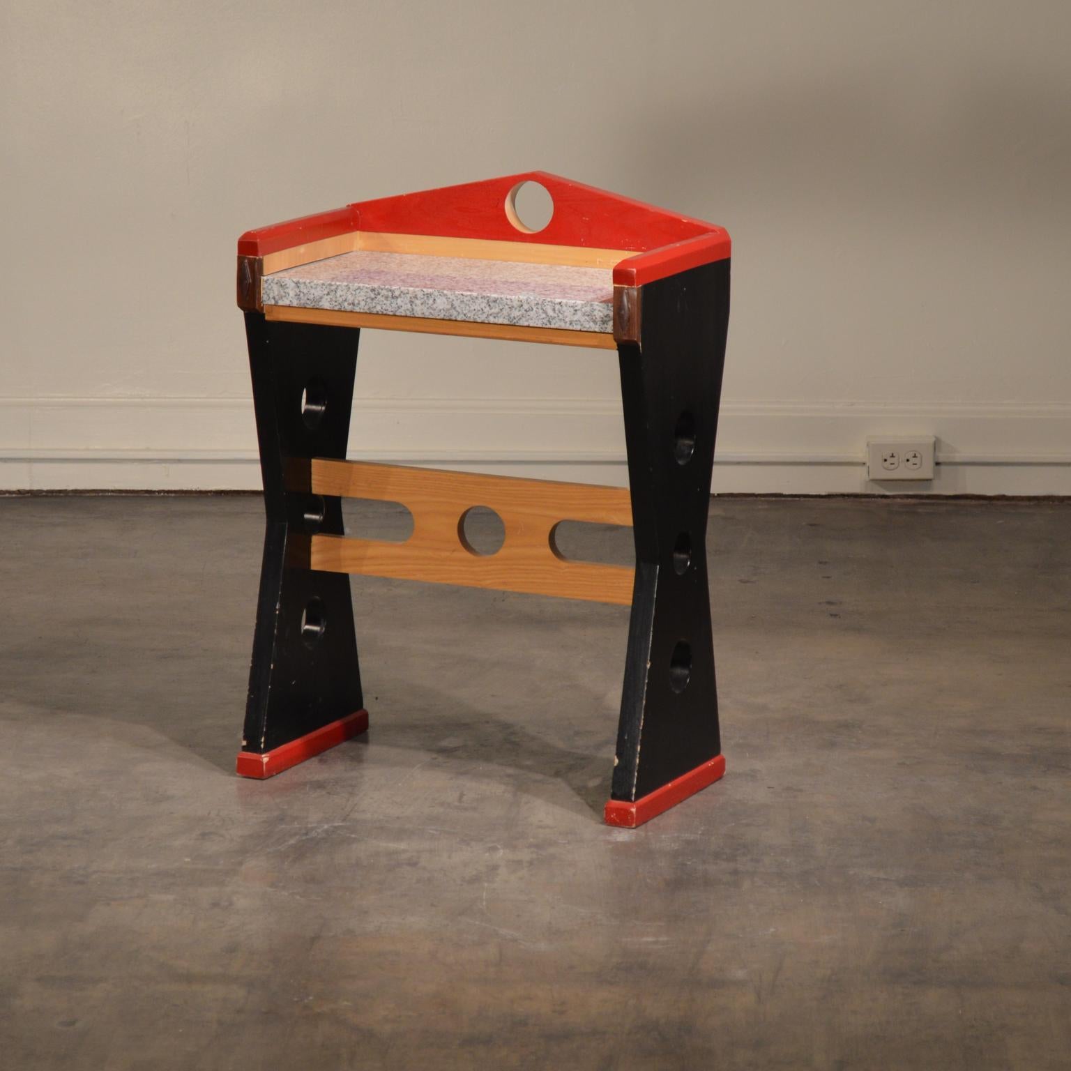 Custom Designed Memphis style console table made of painted wood and granite. This sturdy and stunning Postmodern design would work well in a small entrance way or even as a child's desk. This custom piece came from a Malibu estate designed in