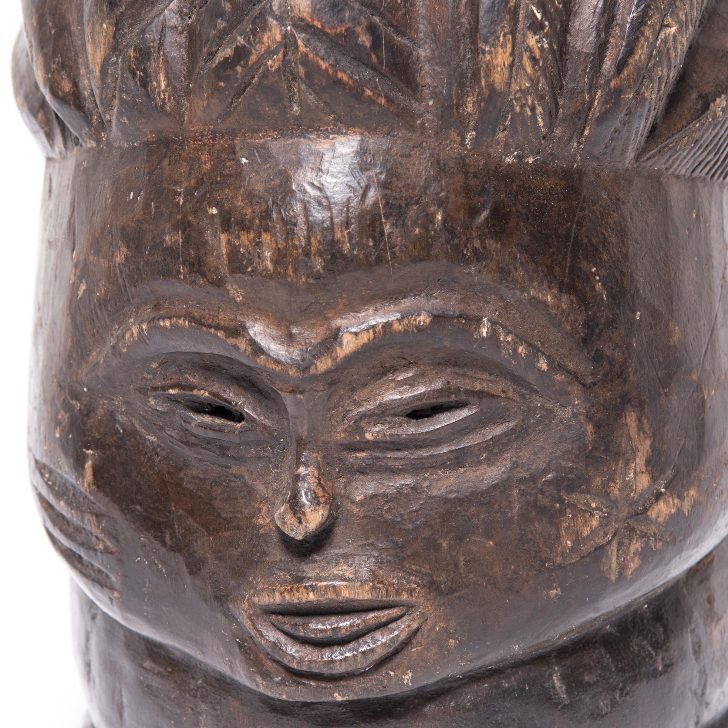 This helmet mask created by the Mende of Sierra Leone was made for the women of their tribe to wear while dancing. Commissioned by women for their initiation ceremonies, the masks were carved by men to depict the ideal female face. Designed to rest