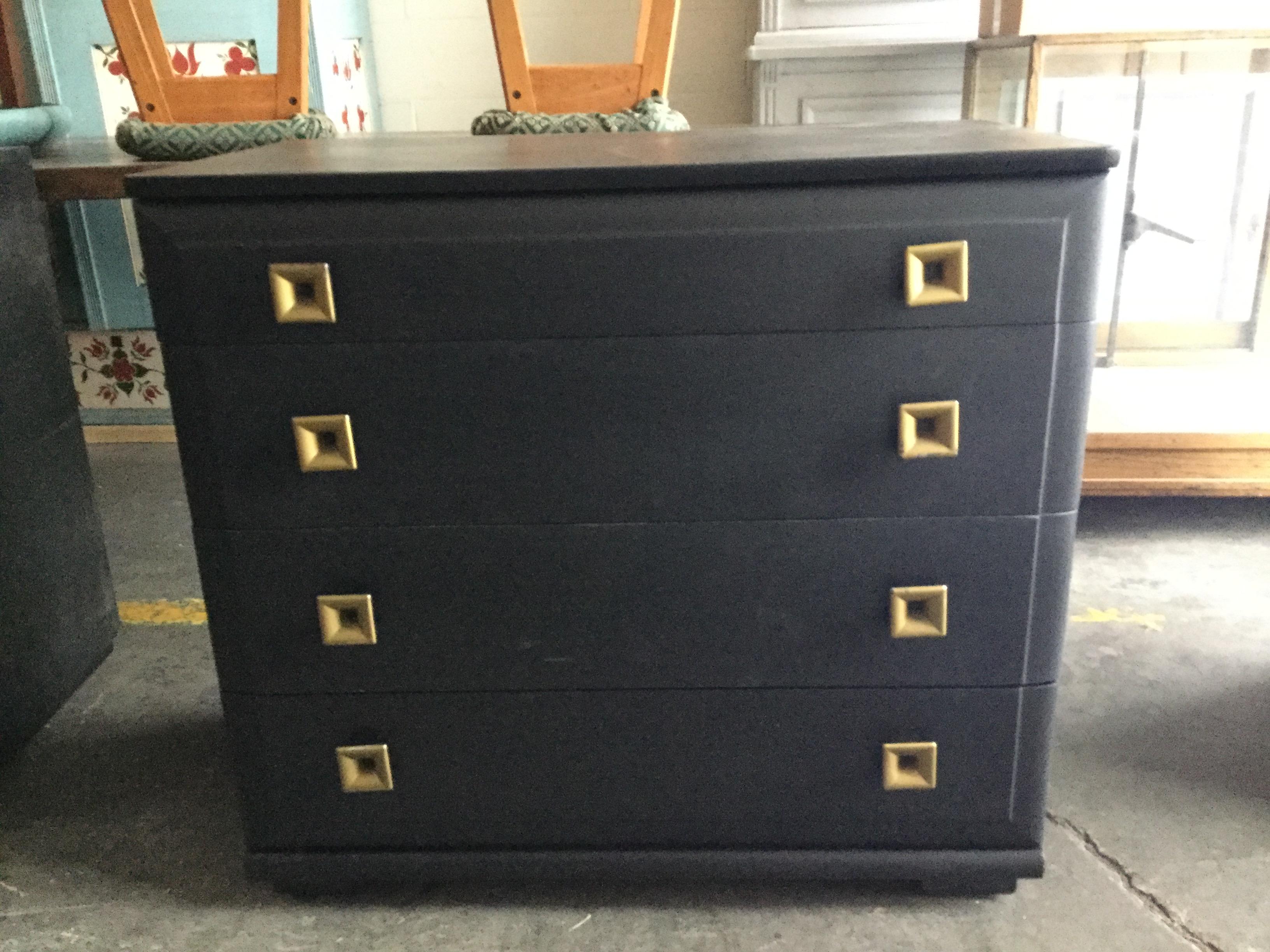 Two black Art Deco dressers 
Four drawers 
Square brass handles 
Makers Mark on back.