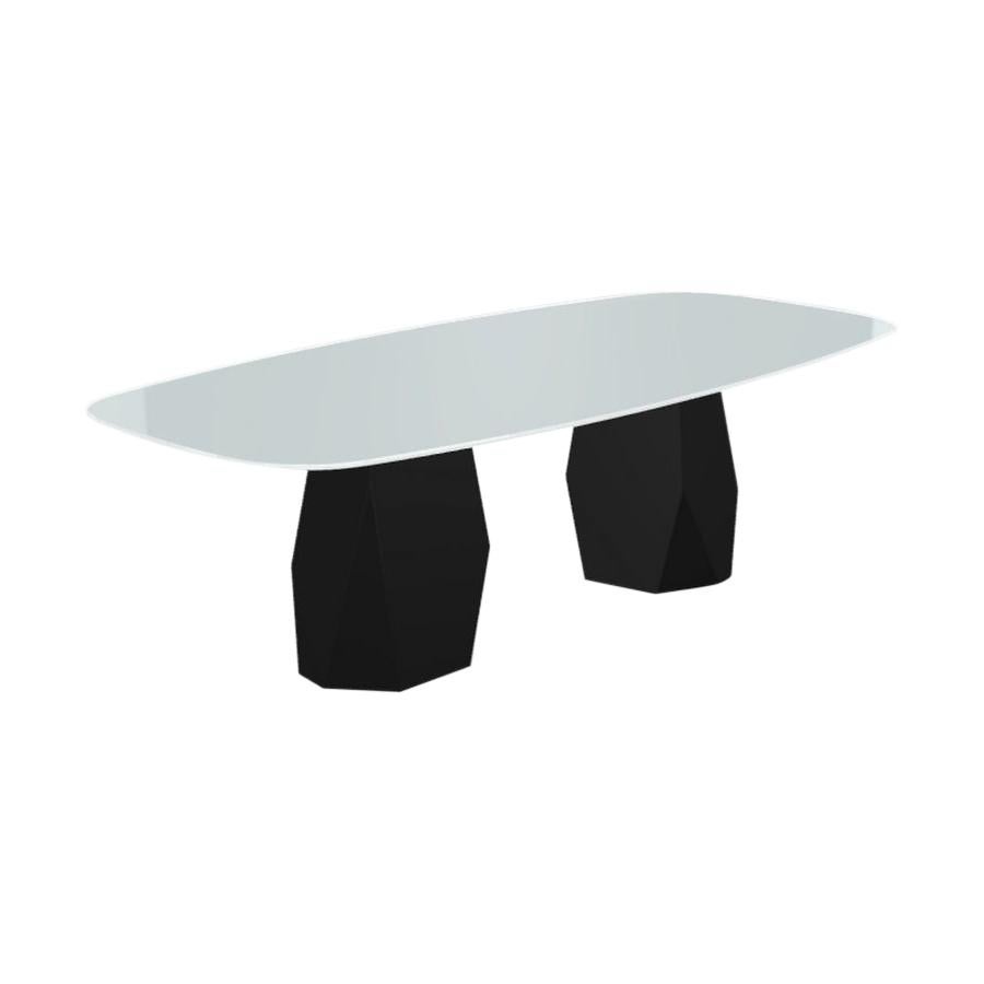 Table de salle à manger à deux pieds Menhir avec plateau en verre blanc sur base en métal noir