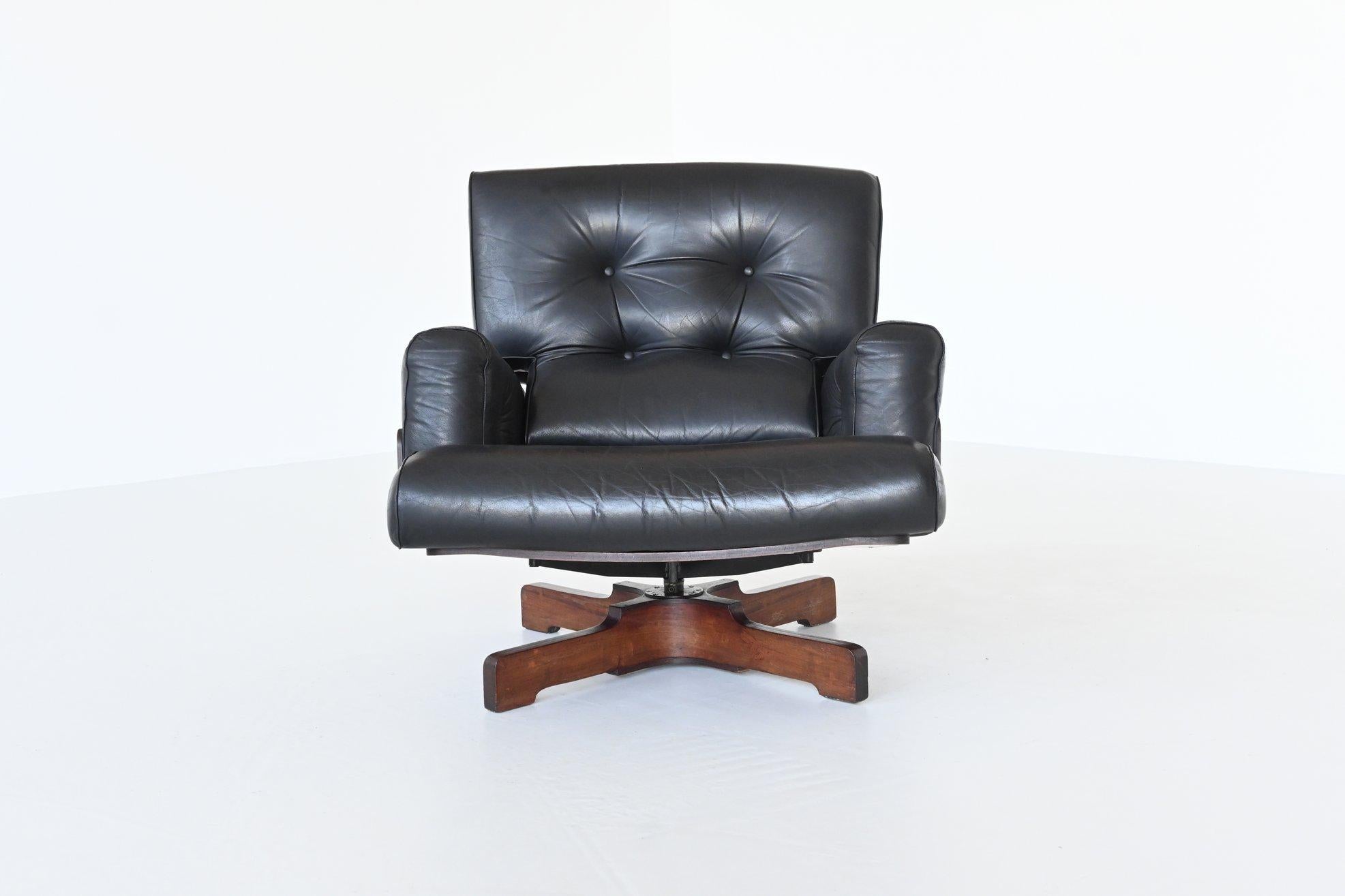 Stunning lounge chair model 401 designed by Menilio Taro for Cinova, Italy, 1964. This fantastic shaped lounge chair set is made of rosewood plywood and has high quality black leather tufted cushions. The base of the chair is made of solid rosewood