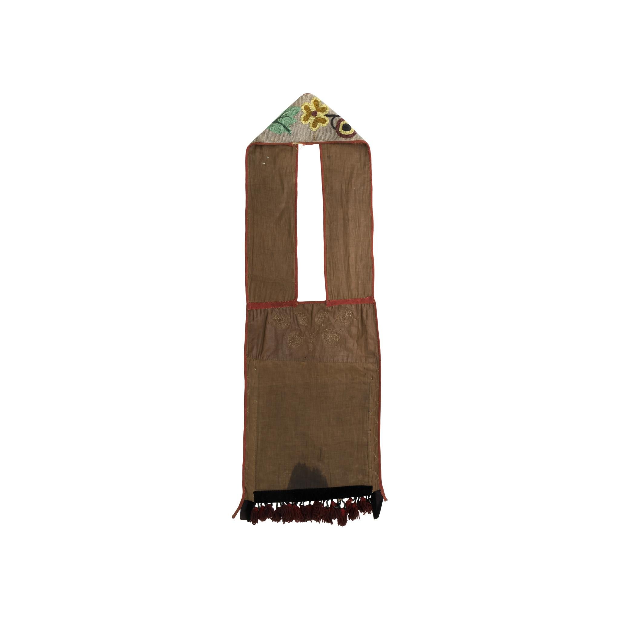19th Century Menominee Bandolier Bag. Both bag and shoulder strap feature floral beadwork design throughout. The beaded bags were made by women but typically worn by men for dance occasions. Although sometimes used as bags, they were more important