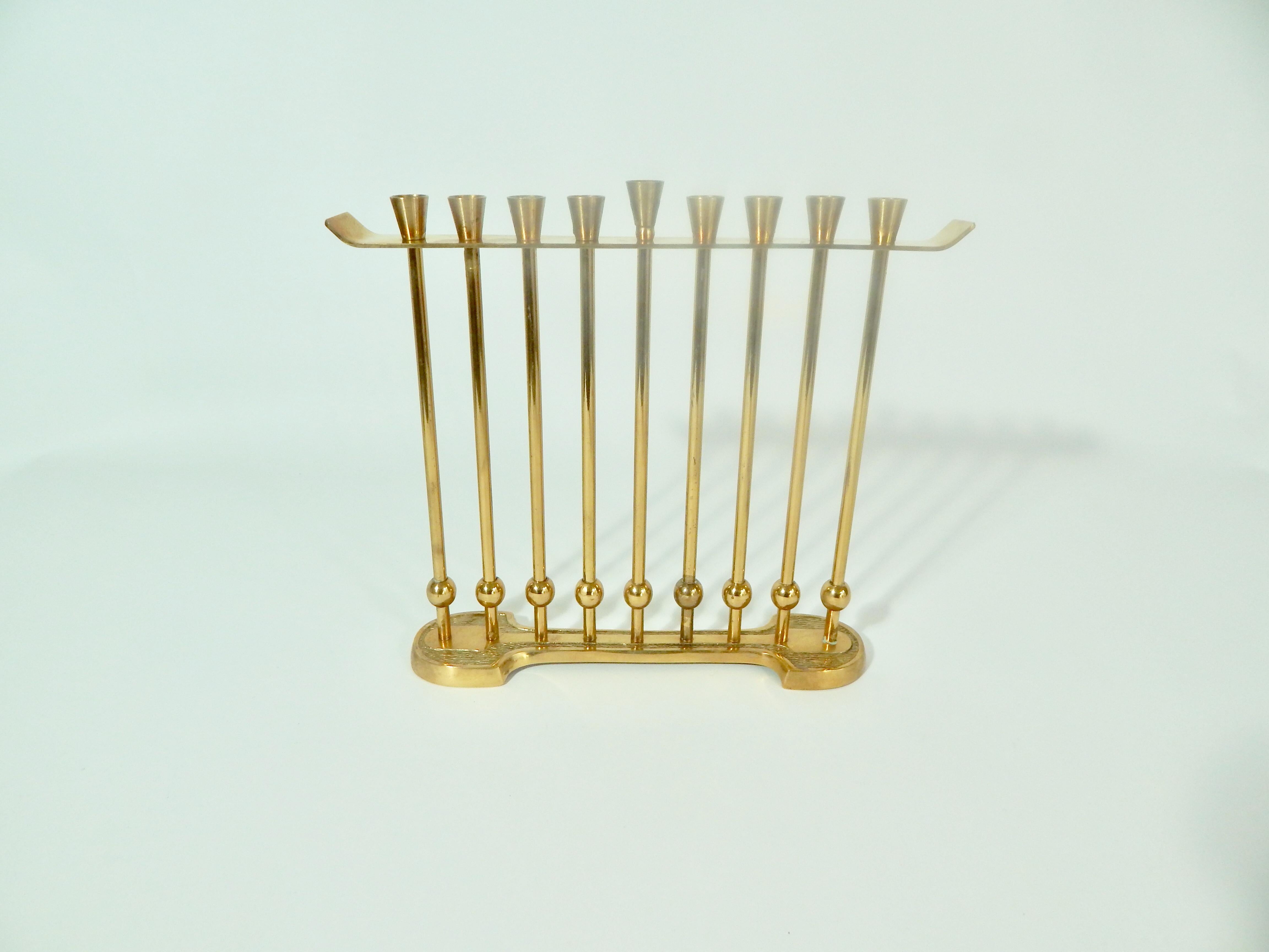 Solid brass midcentury Menorah by Wainberg. Made in Israel. All pieces can be disassembled for cleaning or polishing.
We offer free complimentary domestic shipping for this item. 