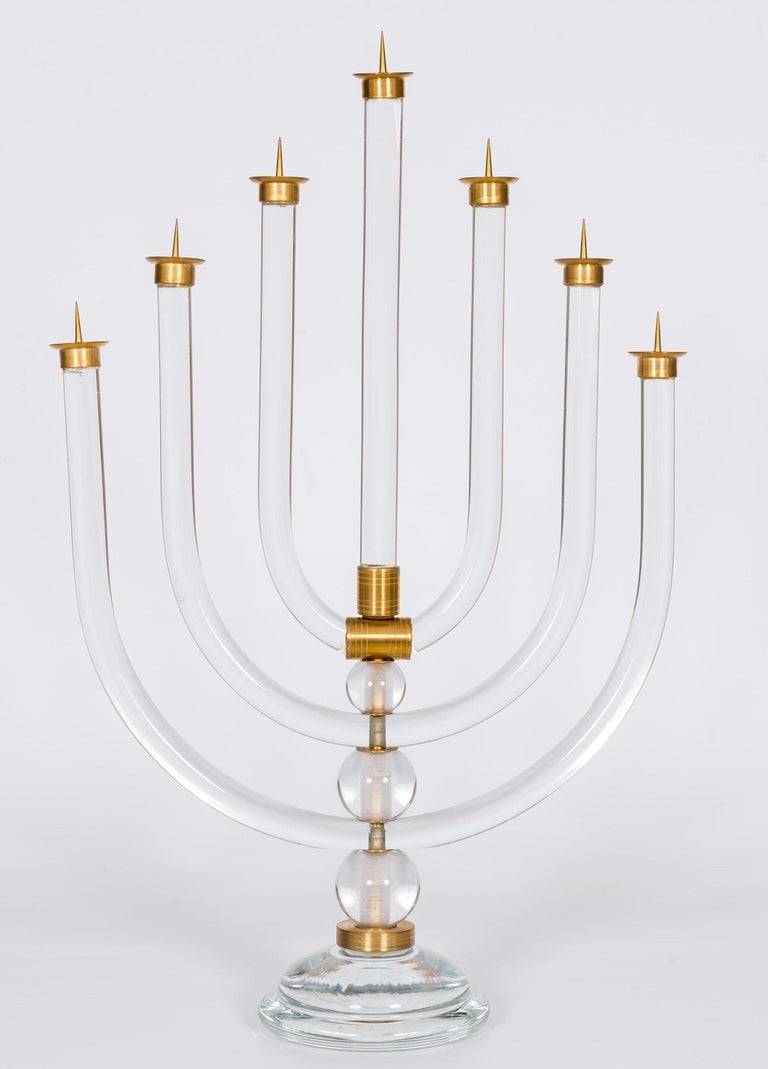 High-End Menorah Jewish Candelabrum in Blown Murano Glass, Vintage Murano Gallery 1970s.
This unique Murano glass masterpiece is one of the most traditional objects in the Jewish tradition.
On top of the round base, a brass rod sustains the seven