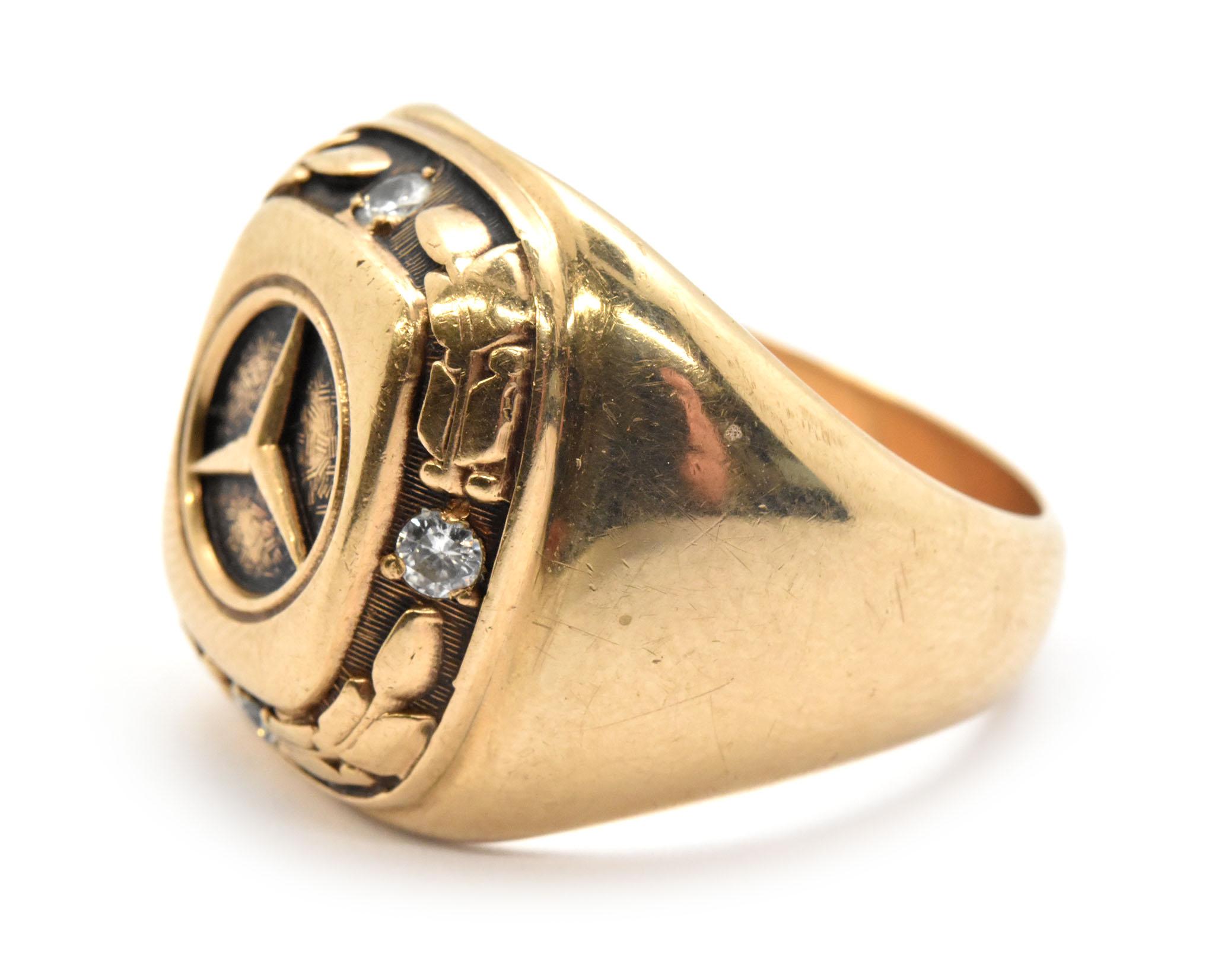 18k gold ring with mercedes emblem