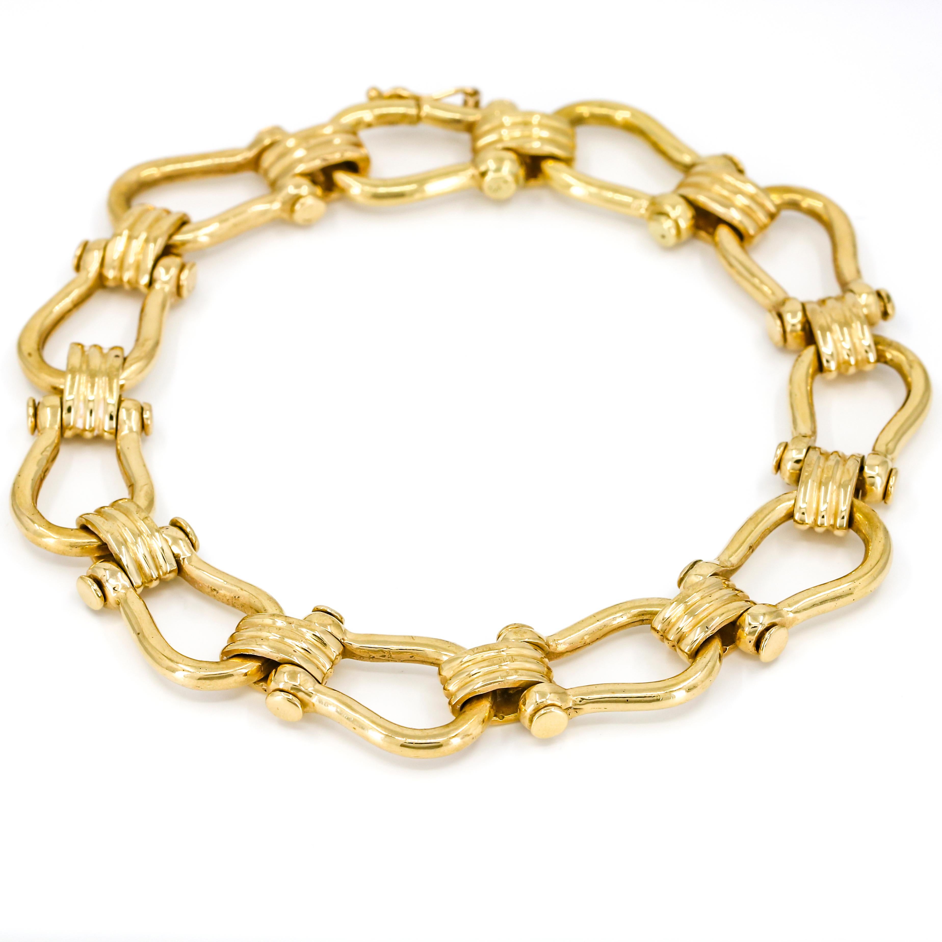 Men's nautical shackle link bracelet crafted in 14-karat yellow gold. Seamless hook clasp with safety. 

Size, Large
Length, 8.5 inches
Width, 12.5 
Depth, 5.5mm
Weight, 40.5 grams 

Previously owned, in excellent condition. Original packaging not