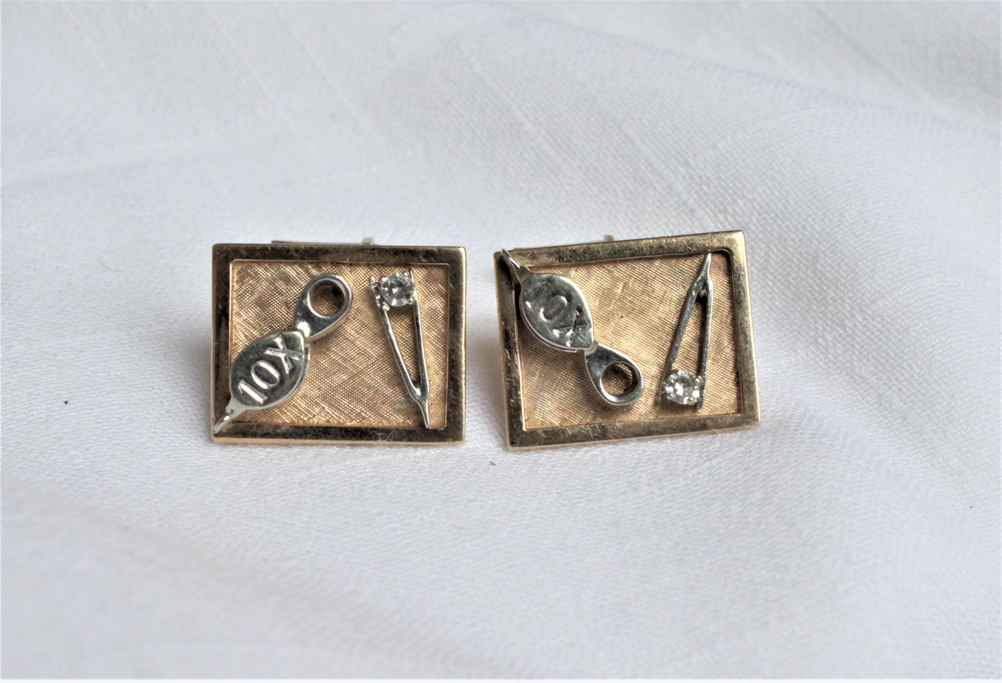 This pair of men’s gold and diamond cufflinks have no maker's marks, but presumed to have been made in the United States in the period and style of Mid-Century Modernism. The cufflinks are composed of solid 14-karat yellow and white gold featuring a