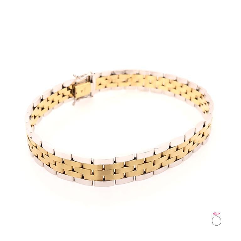 Men's 14K yellow and white gold jubilee link bracelet. This stunning men's bracelet features a beautiful geometric Jubilee design. This Italian made bracelet is very well crafted in 14K yellow and white gold. The yellow gold center links have a