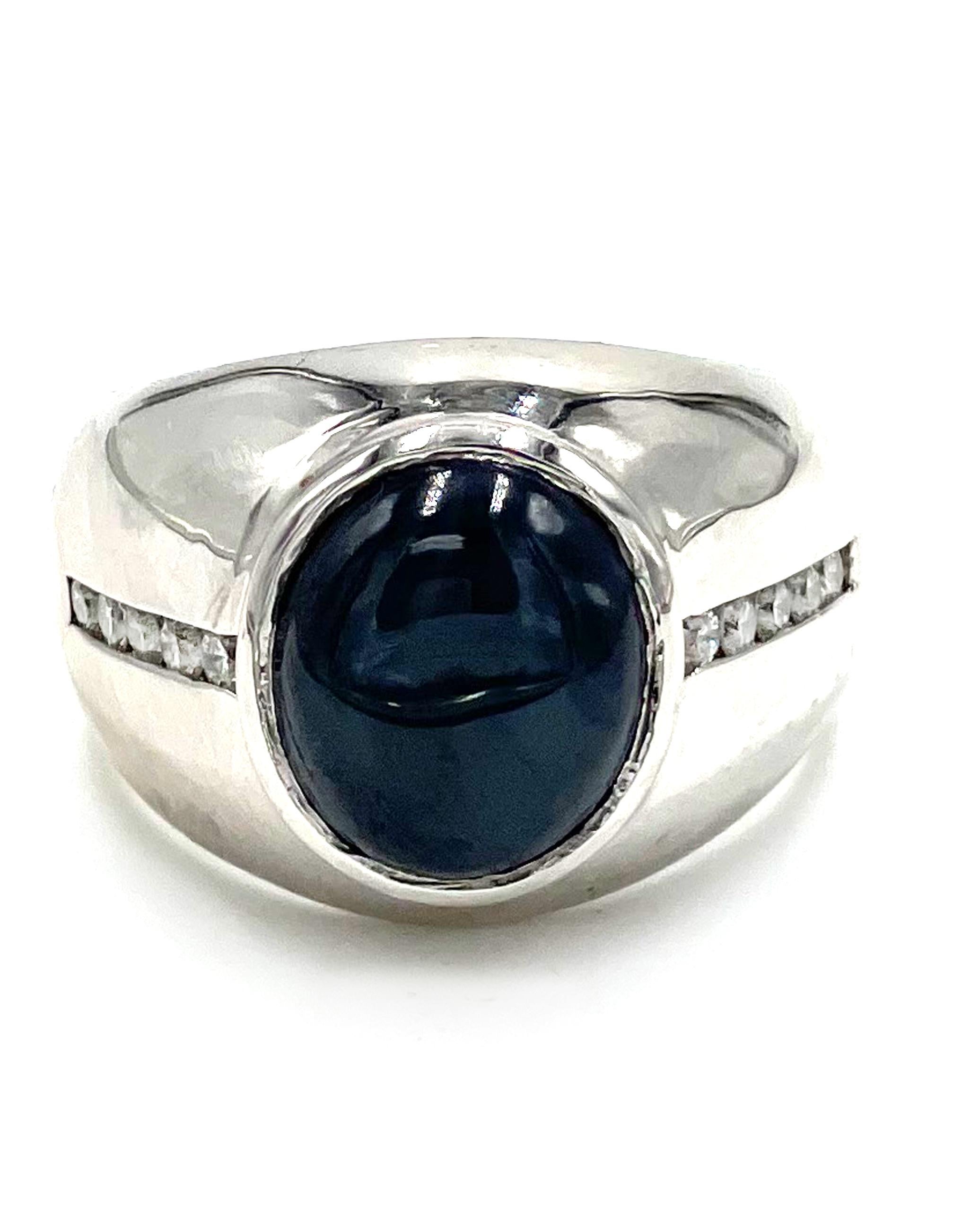 14K white gold men's ring with 10 round brilliant-cut diamonds 0.40 carat total weight and one oval shape cabochon cut star sapphire 8.50 carats.

* Finger size: 10.5
* Diamonds are G color, SI clarity.
* Top measures 7.36mm wide and tapers down to