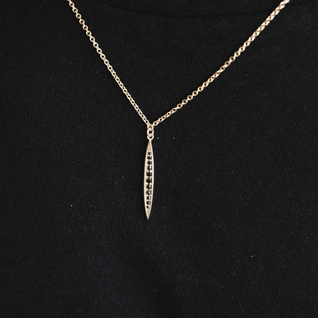 Men’s 14K Yellow Gold Black Diamond Pendant Necklace for Him by Shlomit Rogel.

Simple yet timeless, this diamond necklace is part of Rogel's collection for men. Crafted from 14k solid yellow gold and set with 11 black diamonds, this necklace is